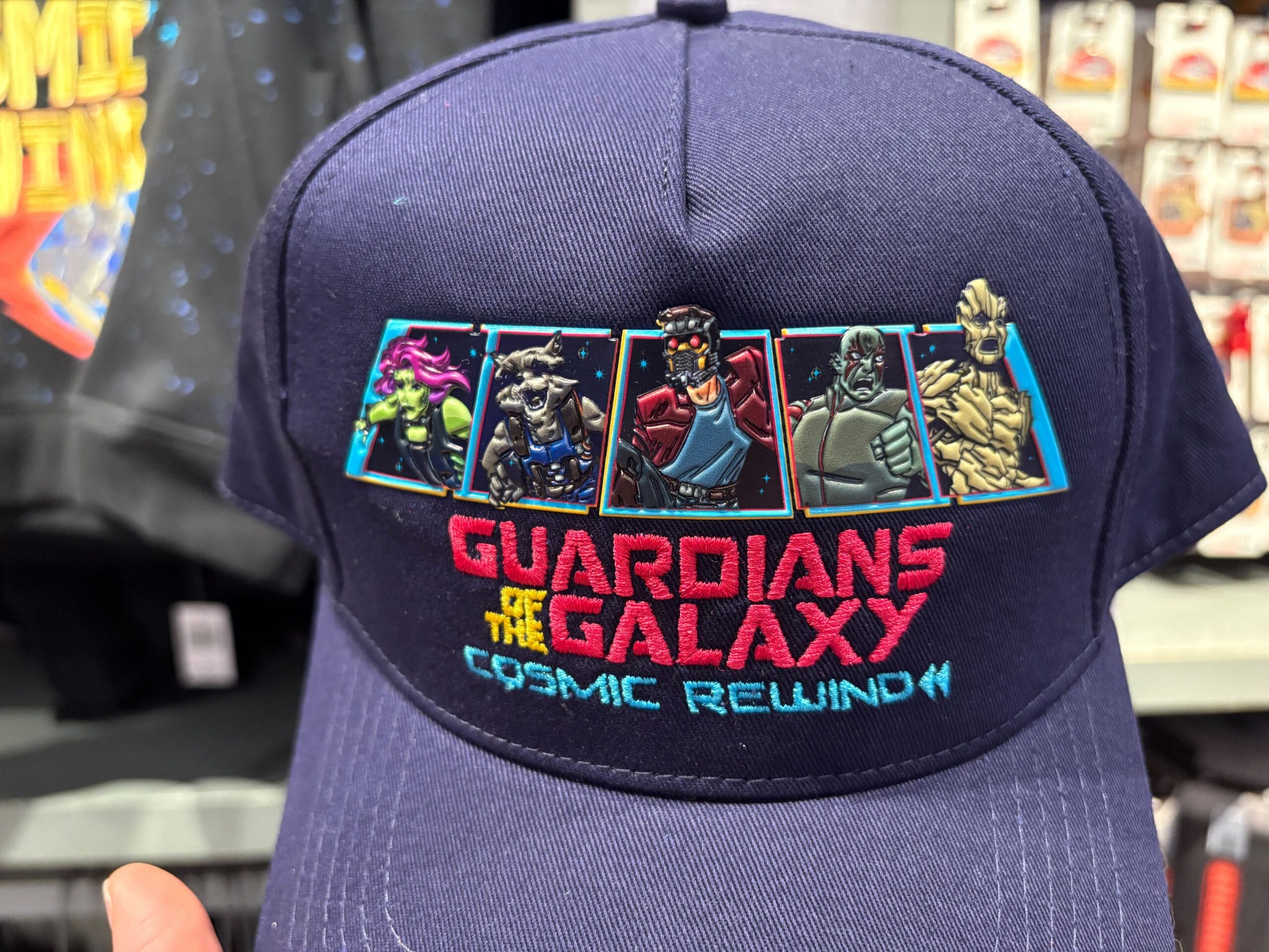 A navy cap featuring Guardians of the Galaxy characters and the text "Guardians of the Galaxy Cosmic Rewind".