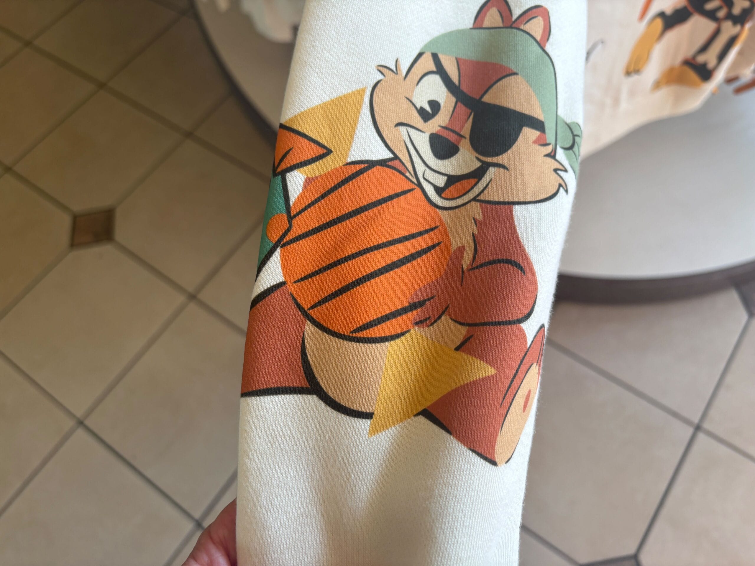 Cartoon chipmunk in a pirate costume with an orange basketball, inspired by Walt Disney World Halloween merchandise.