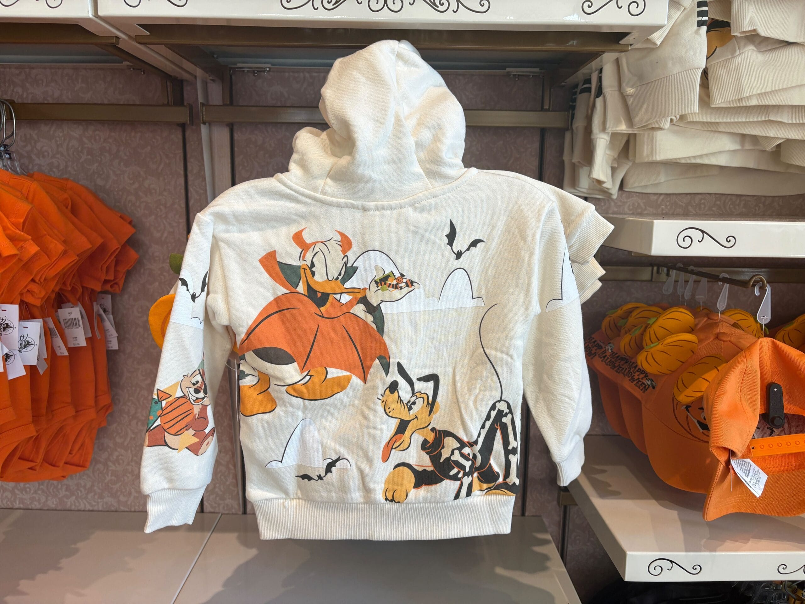 White hoodie with Walt Disney World characters in Halloween costumes, perfect for fans of Halloween Merchandise.