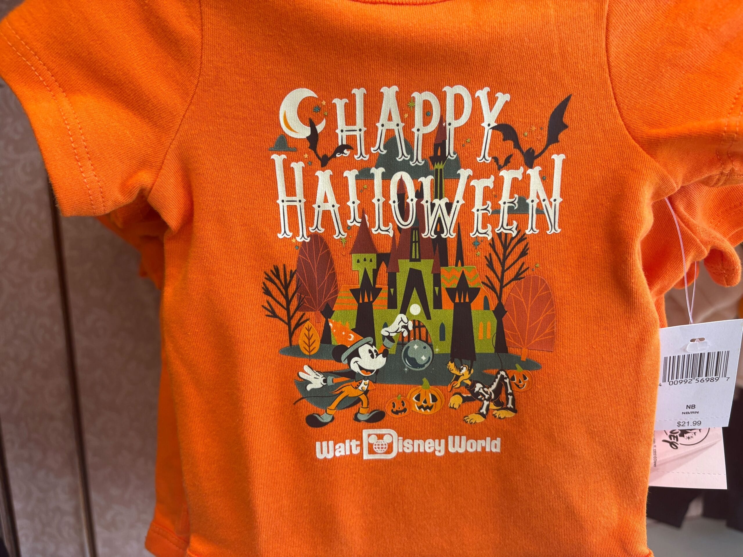 Orange "Happy Halloween" shirt featuring Mickey, Pluto, and haunted house—perfect Walt Disney World Halloween merchandise.