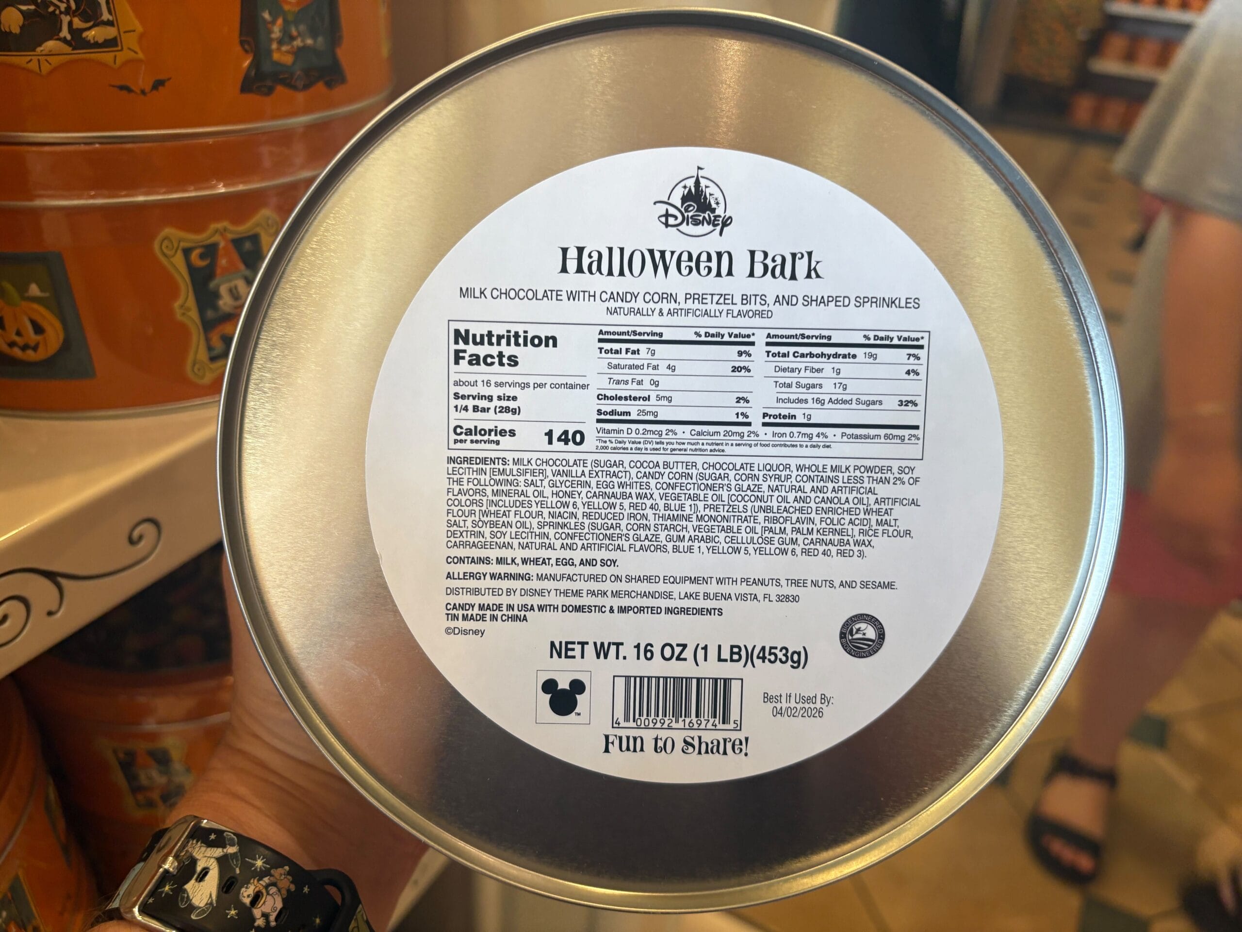 Round tin labeled “Halloween Bark,” part of Walt Disney World Halloween merchandise, with nutrition facts on the lid.