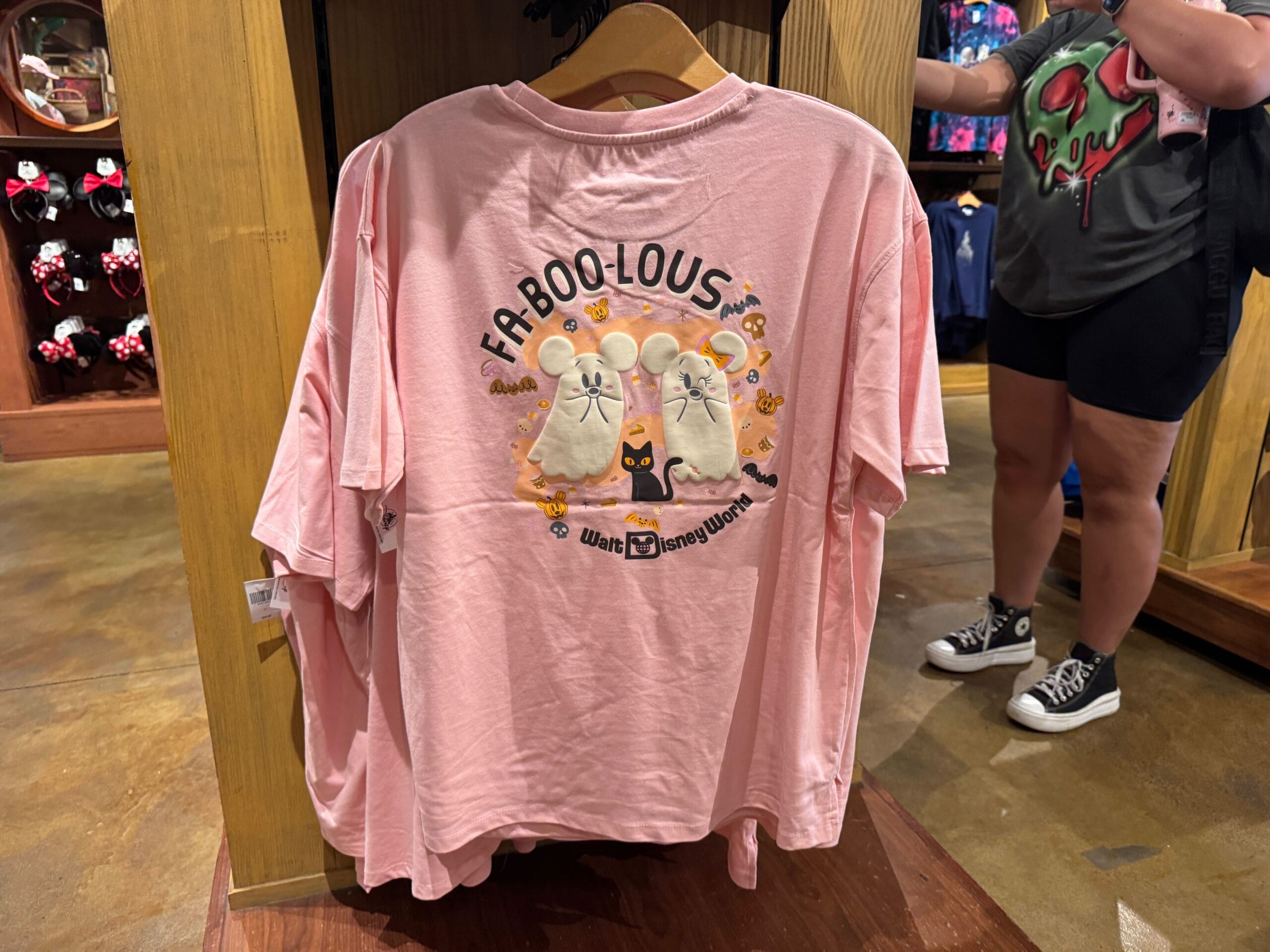 Pink t-shirt with ghost mice, a black cat, and "FABOO-LOUS" text is fun Halloween merchandise at Walt Disney World.