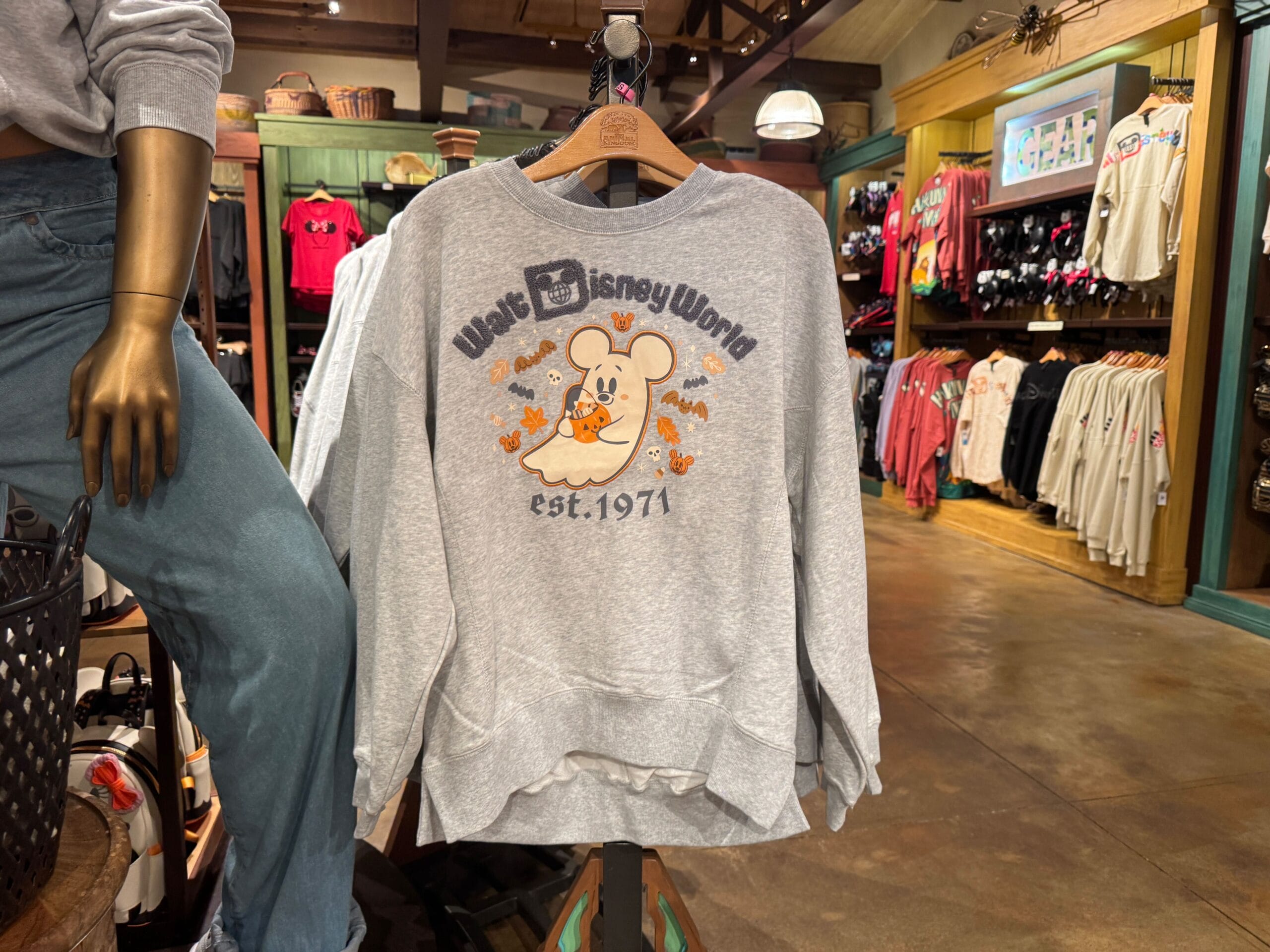 Gray Walt Disney World sweatshirt with Mickey Mouse and fall leaves, part of the new Halloween merchandise in stores.