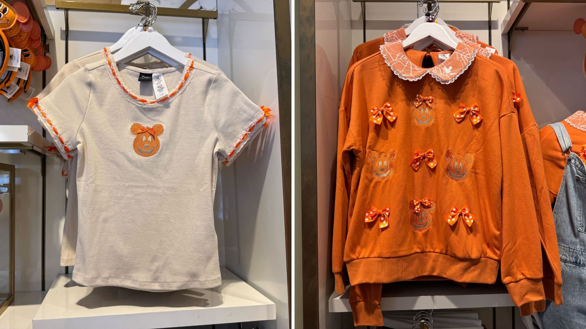 Two Her Universe shirts: one beige with a Minnie Jack-o'-Lantern face, the other orange with lace and bow designs.