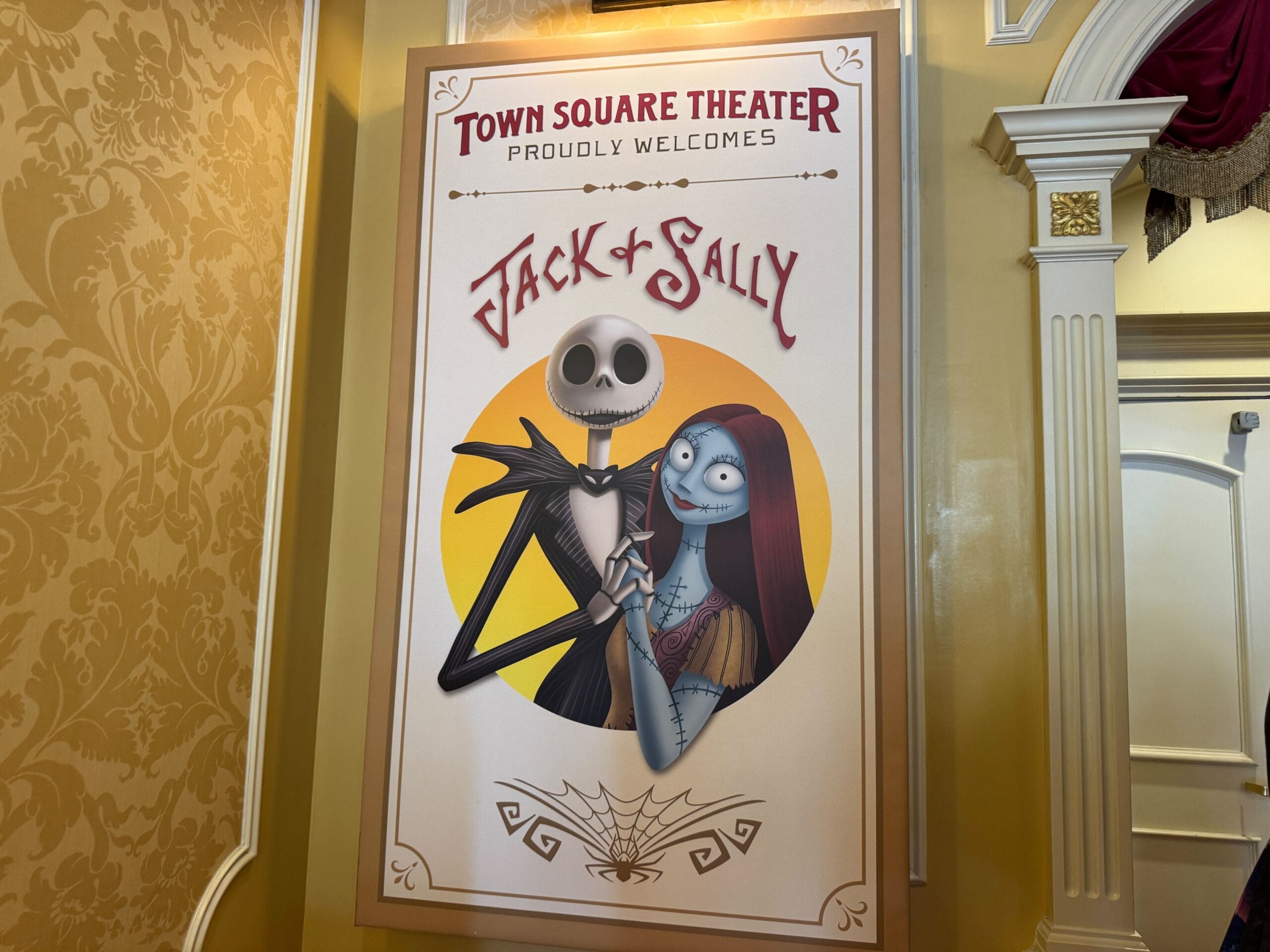 Poster at Town Square Theater teases 2025 character appearances for Mickey's Not So Scary Halloween Party with Jack and Sally holding hands.