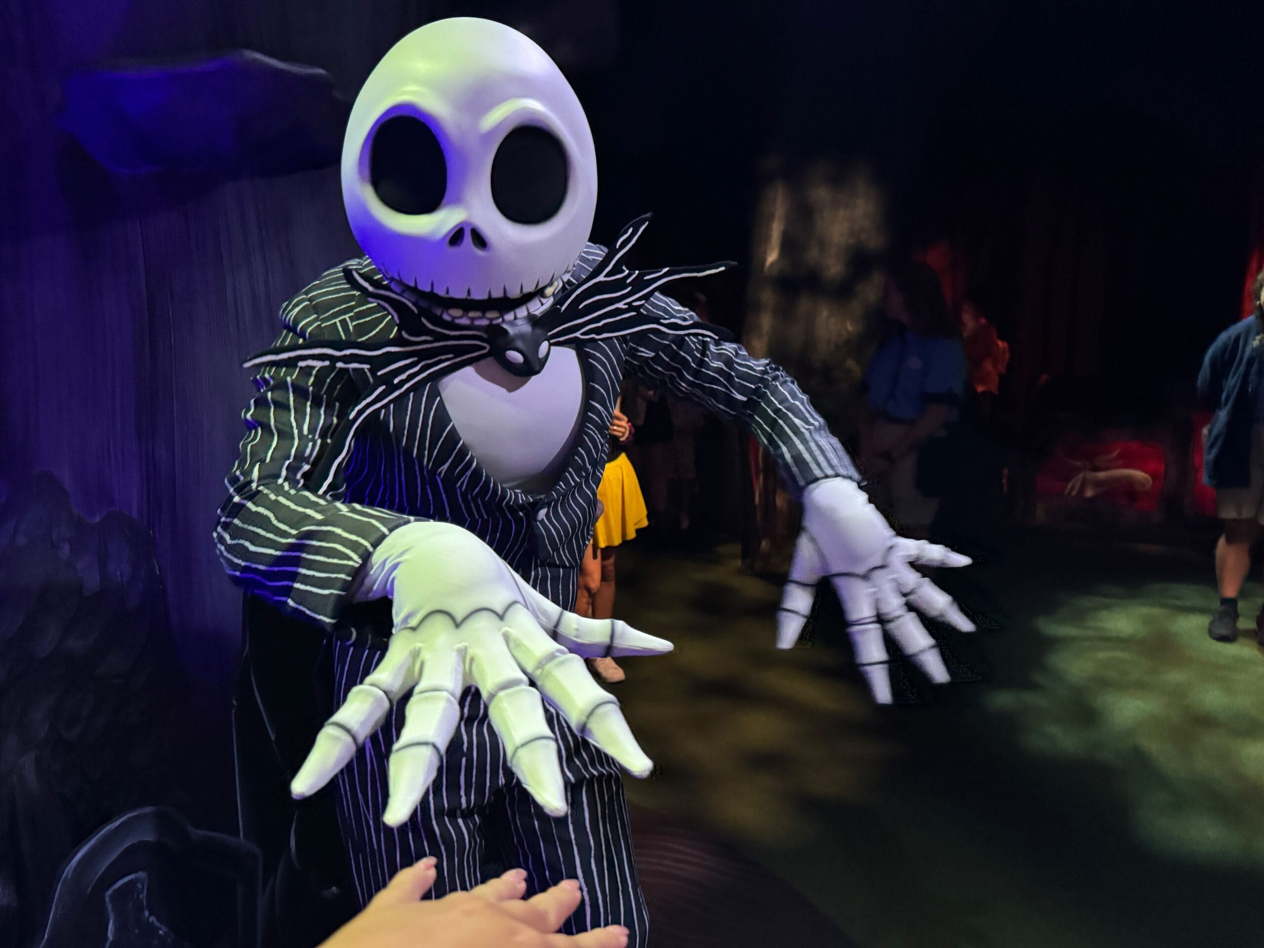 Jack Skellington reaches out at Mickey's Not So Scary Halloween Party 2025 in a dimly lit setting.