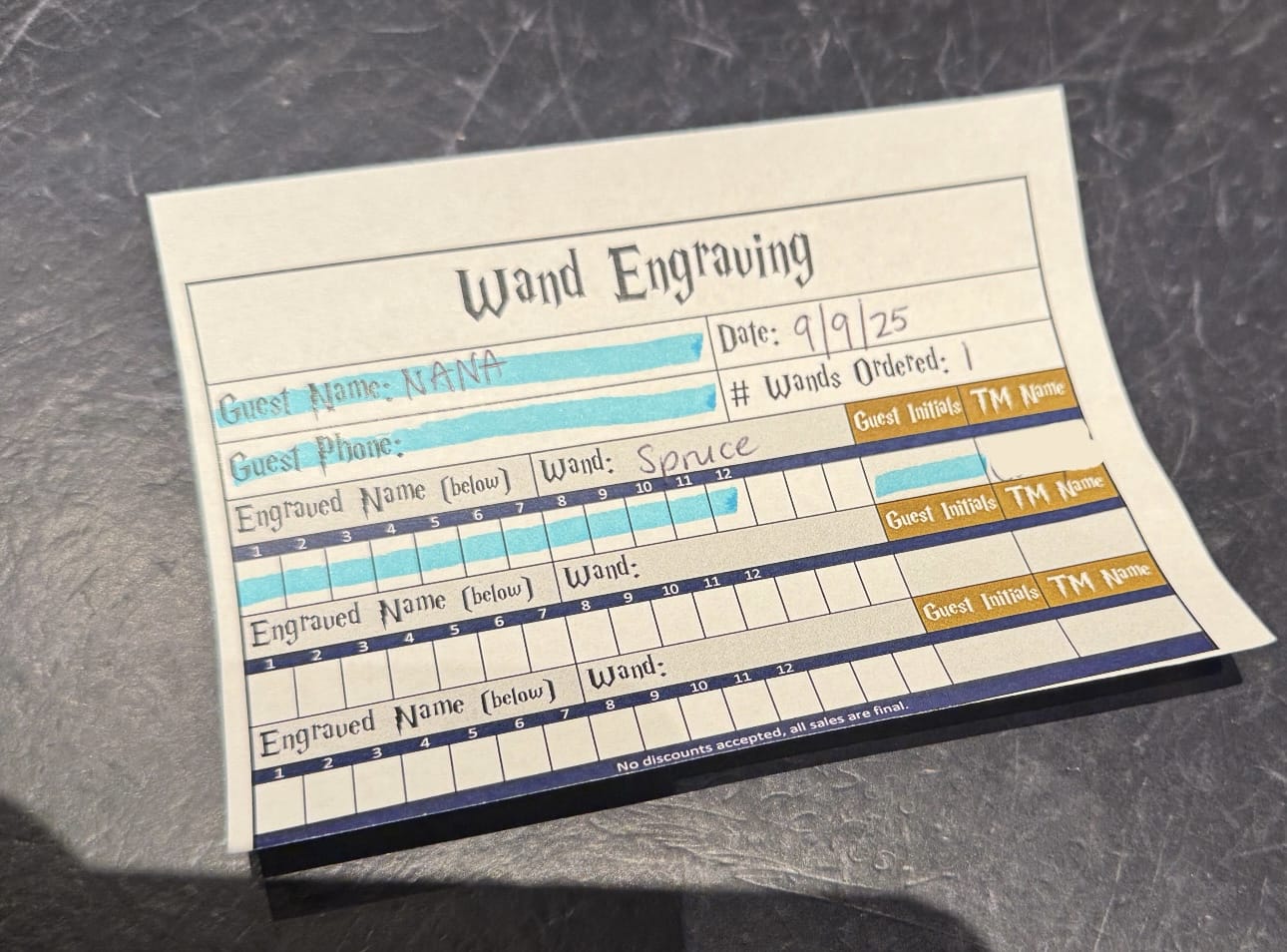 A wand engraving order form to personalize your wand at Epic Universe with "NANA," date "9/9/25," and "Spruce.