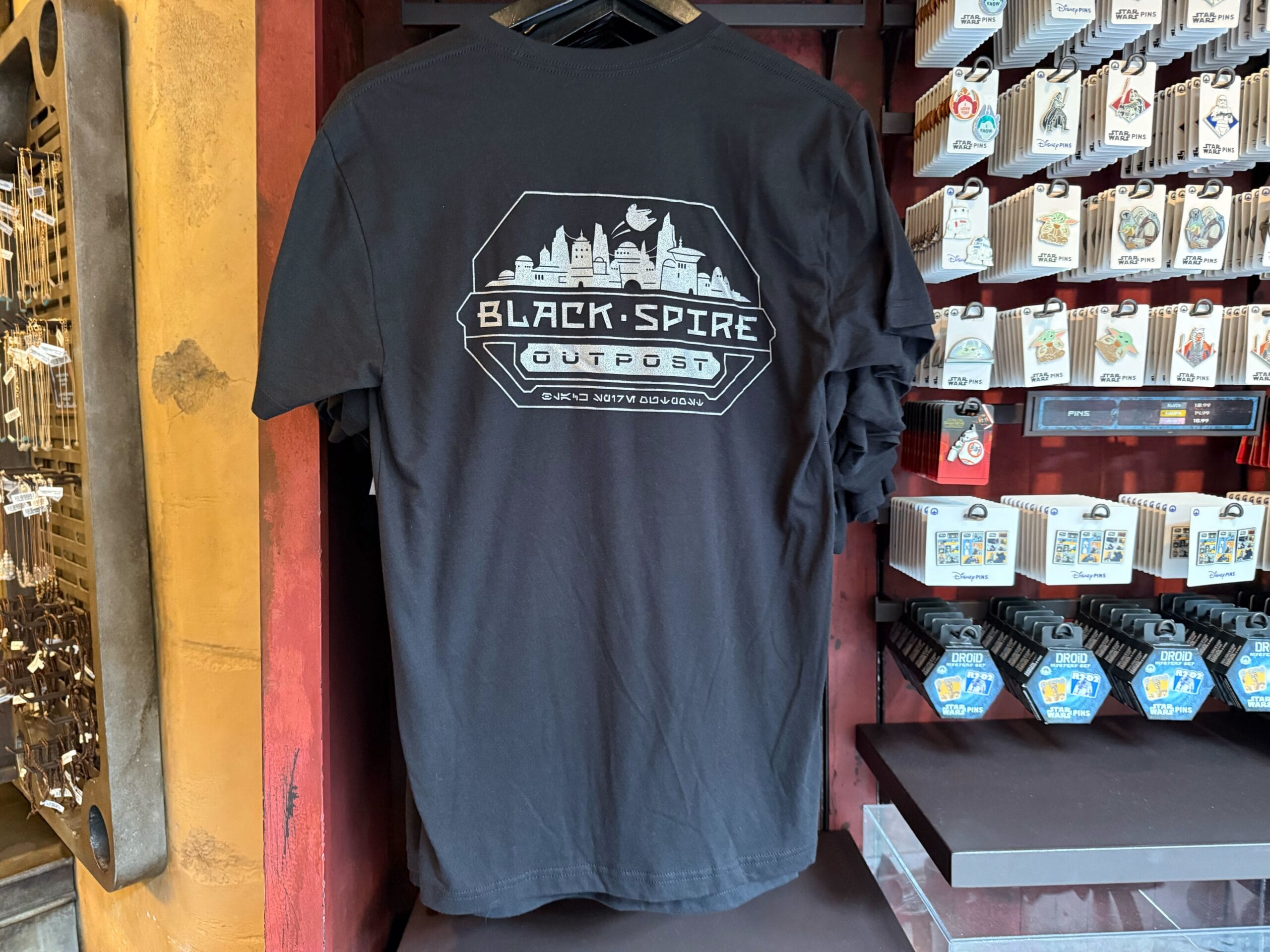 Black t-shirt with a "Black Spire Outpost" graphic, perfect for Star Wars shirts fans visiting Disneyland.