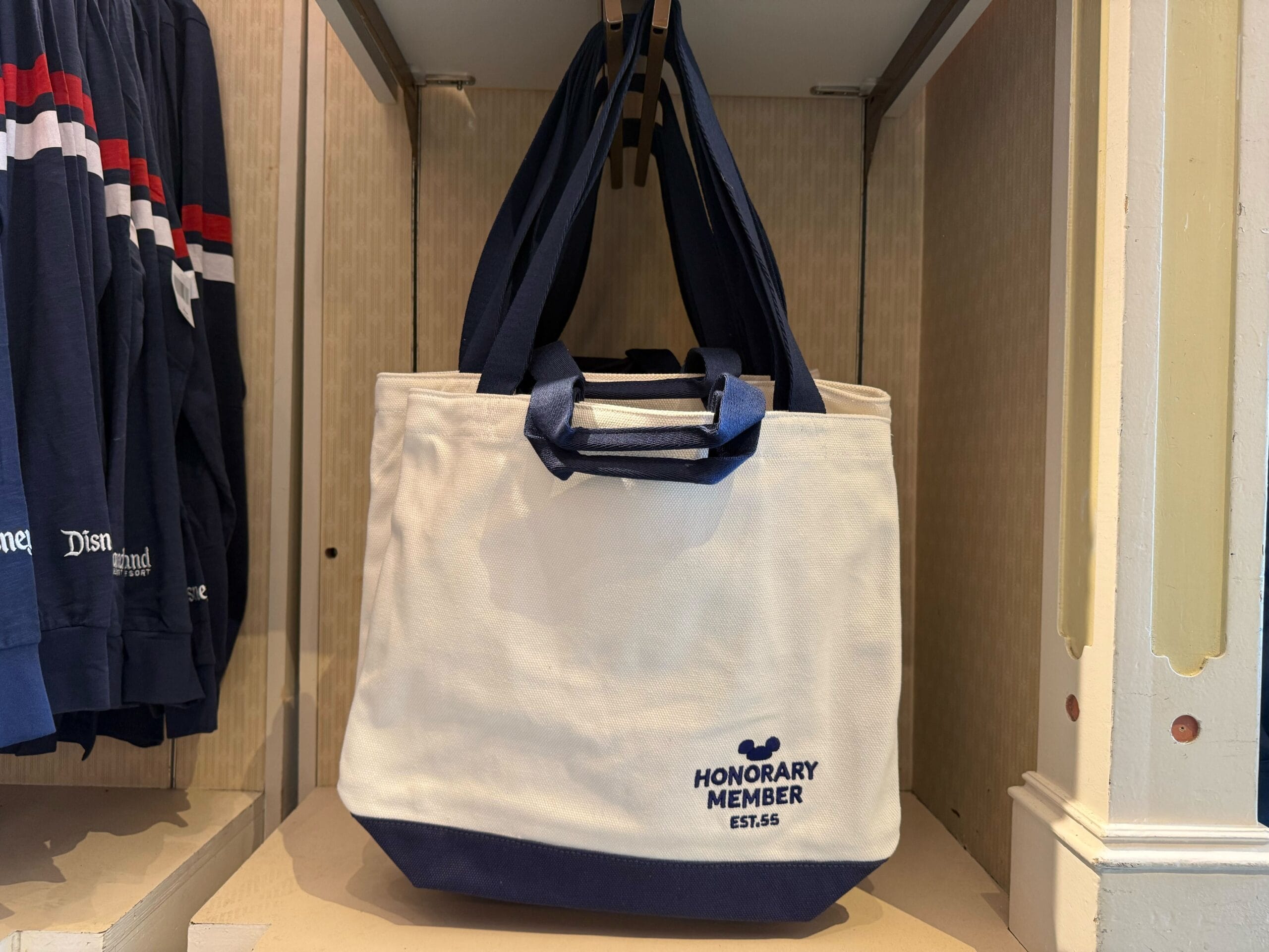 White and navy tote bag with "HONORARY MEMBER EST. 56"—a perfect Mickey Mouse Club merchandise for Disneyland's 70th anniversary.
