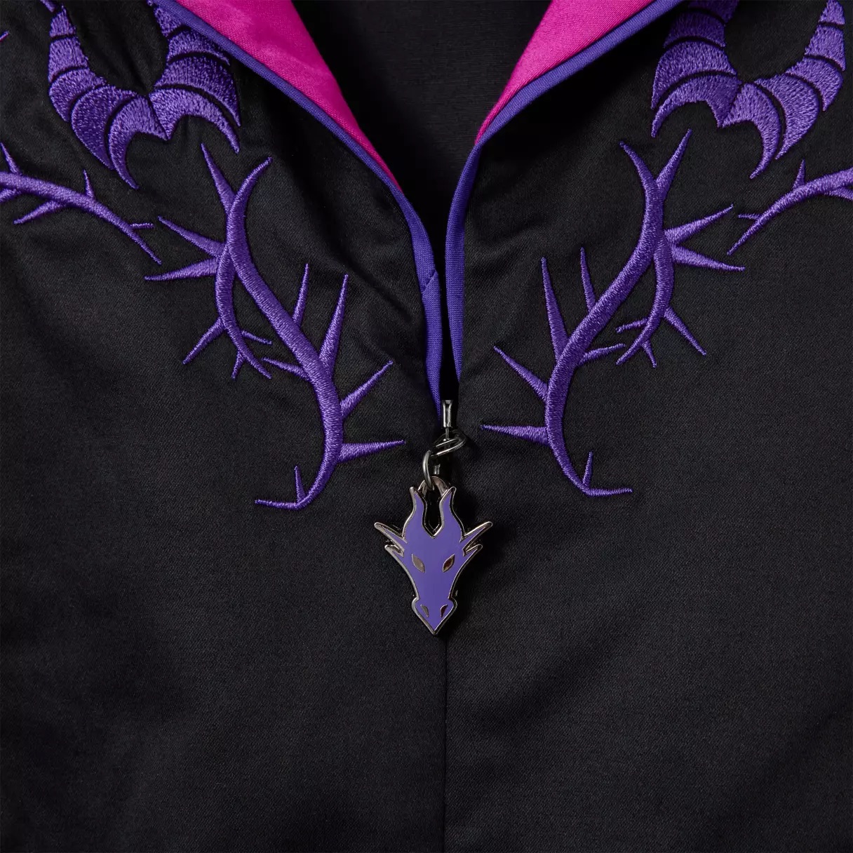 Exclusive Disney Parks Dress Shop piece: black fabric with Maleficent-inspired purple dragon and thorn embroidery, pink lining.