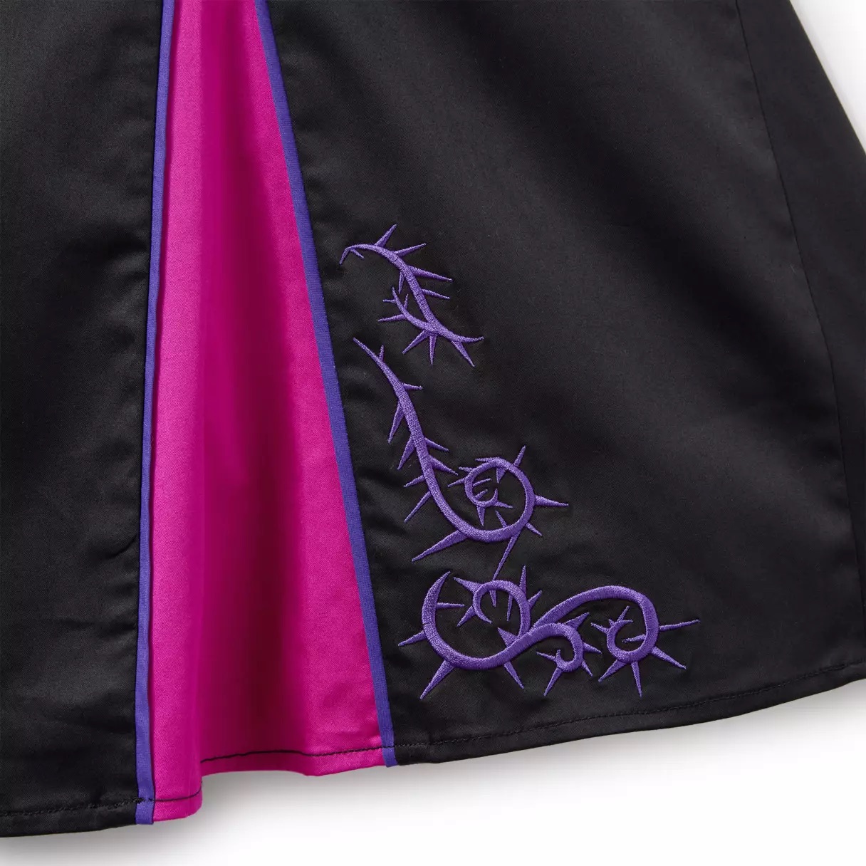 Black skirt with magenta insert and Maleficent-inspired purple thorny vine embroidery near the hem.