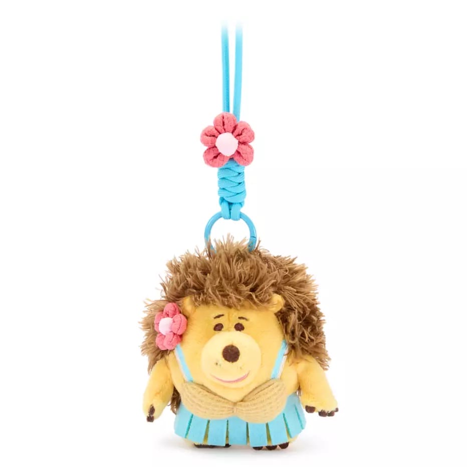 Plush hedgehog keychain from Disney Store China, wearing a blue skirt and flower, perfect for Toy Story Bag Charms.