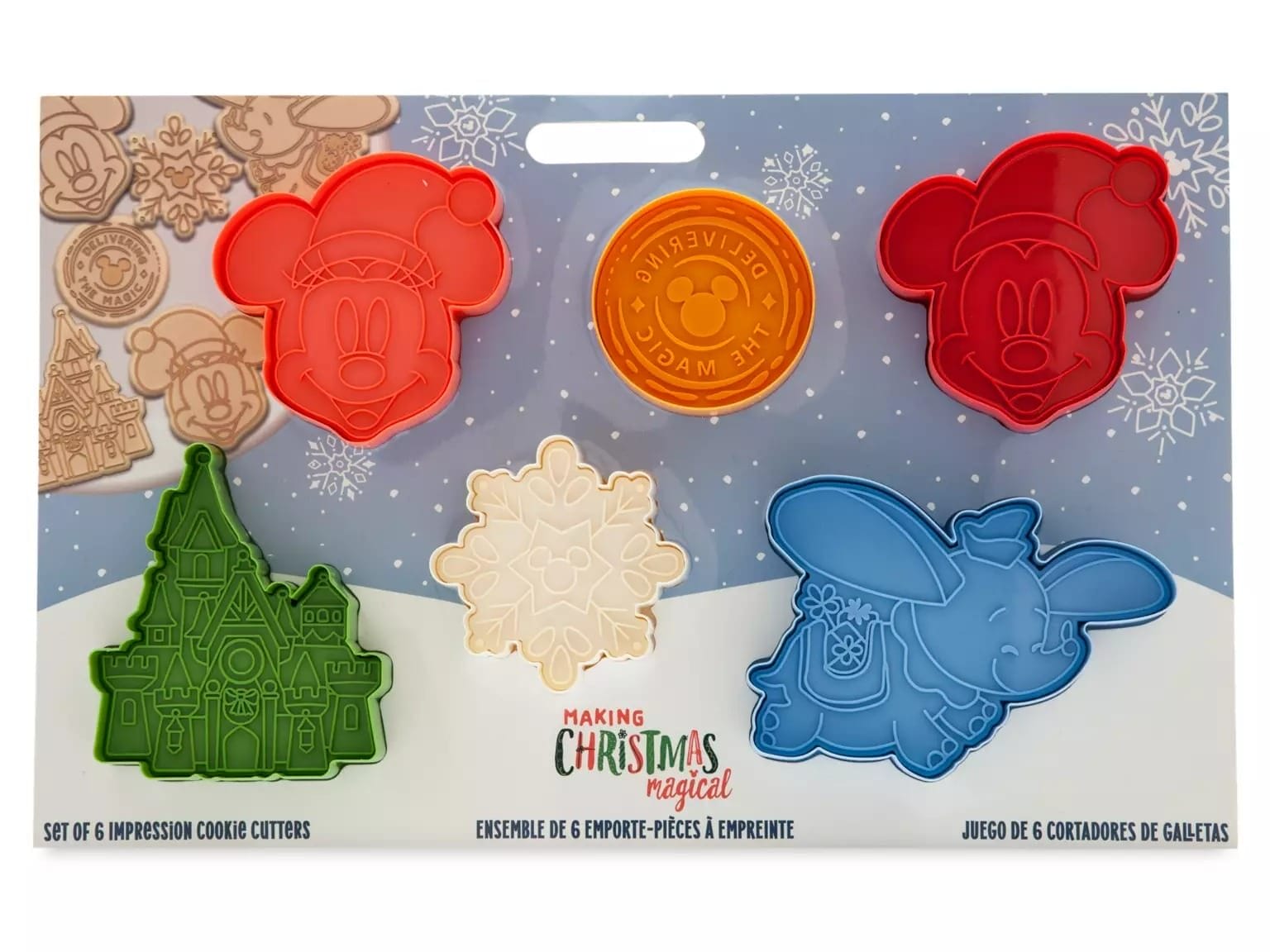 Six Disney Store Christmas cookie cutters and stamps featuring Mickey, Minnie, Dumbo, a coin, house, and snowflake.