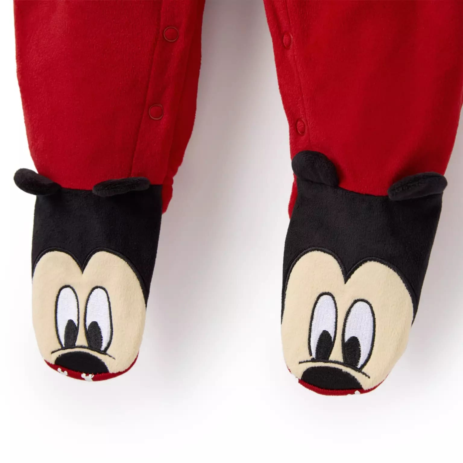 Red pajamas with attached feet, styled as Mickey Mouse faces—Disney Store Christmas merchandise for 2025.