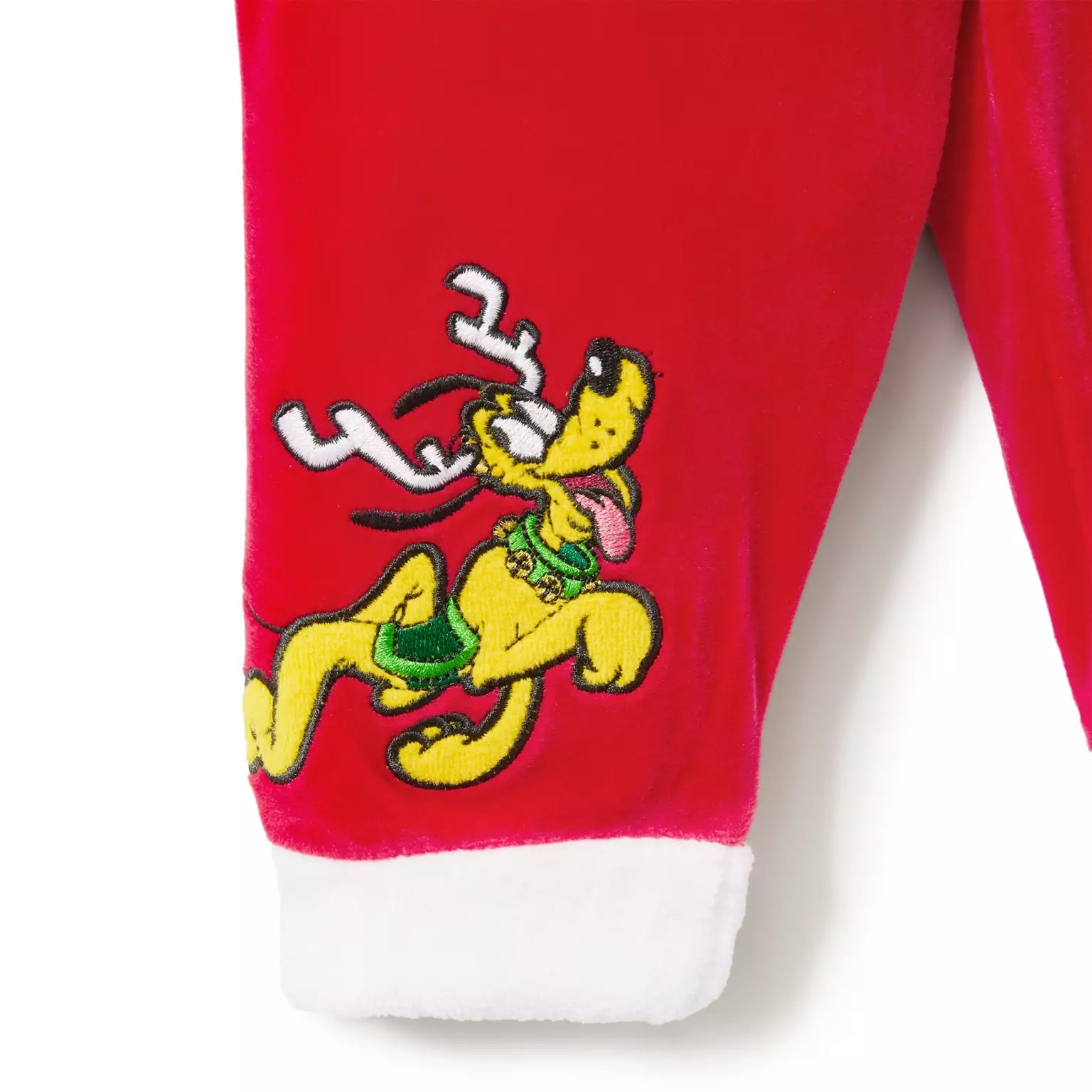 Red pajamas with white cuffs, part of the 2025 Disney Christmas merchandise, feature Pluto in reindeer antlers and a green collar.