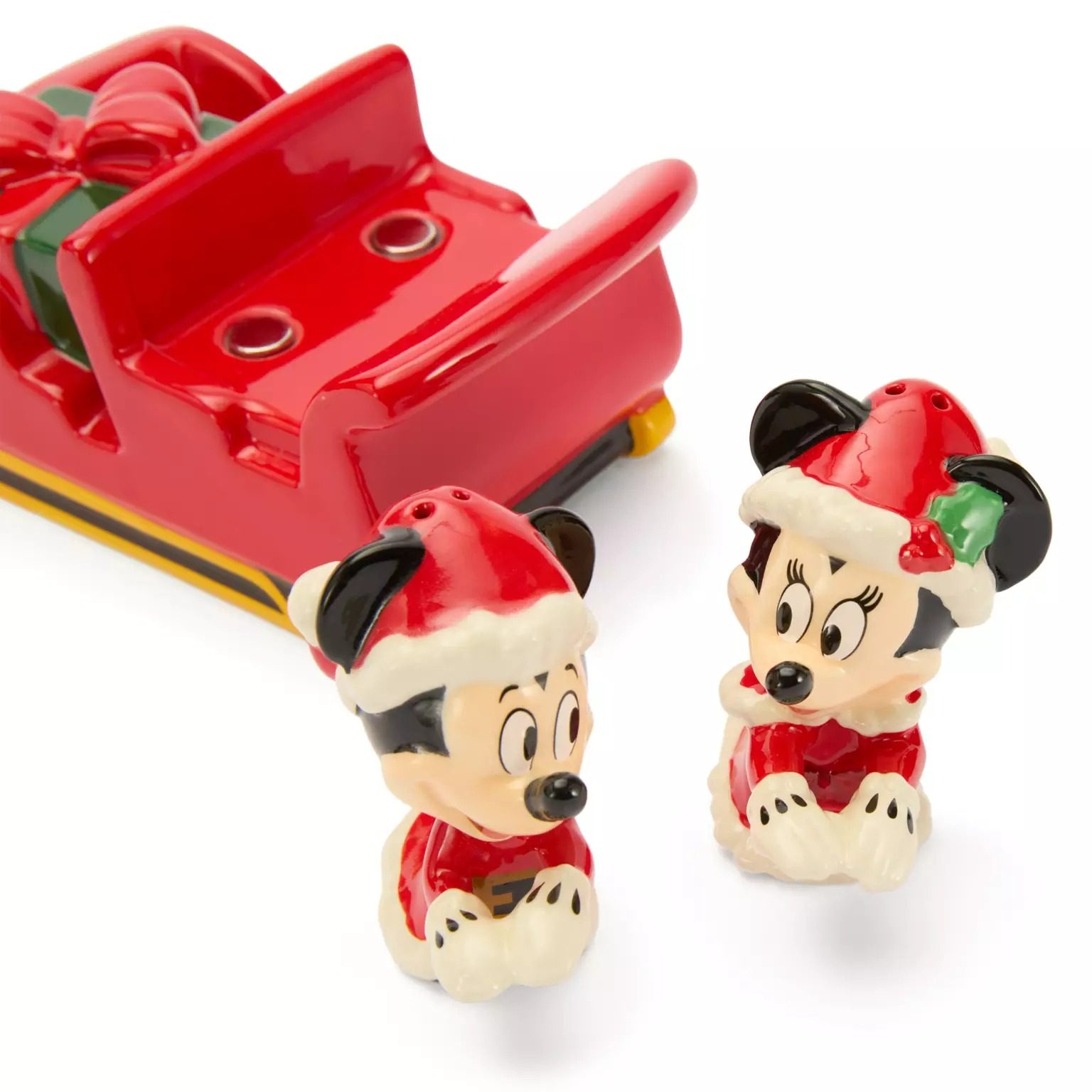 Mickey and Minnie Mouse salt and pepper shakers in Santa hats, a 2025 Disney Store Christmas collectible sleigh holder.