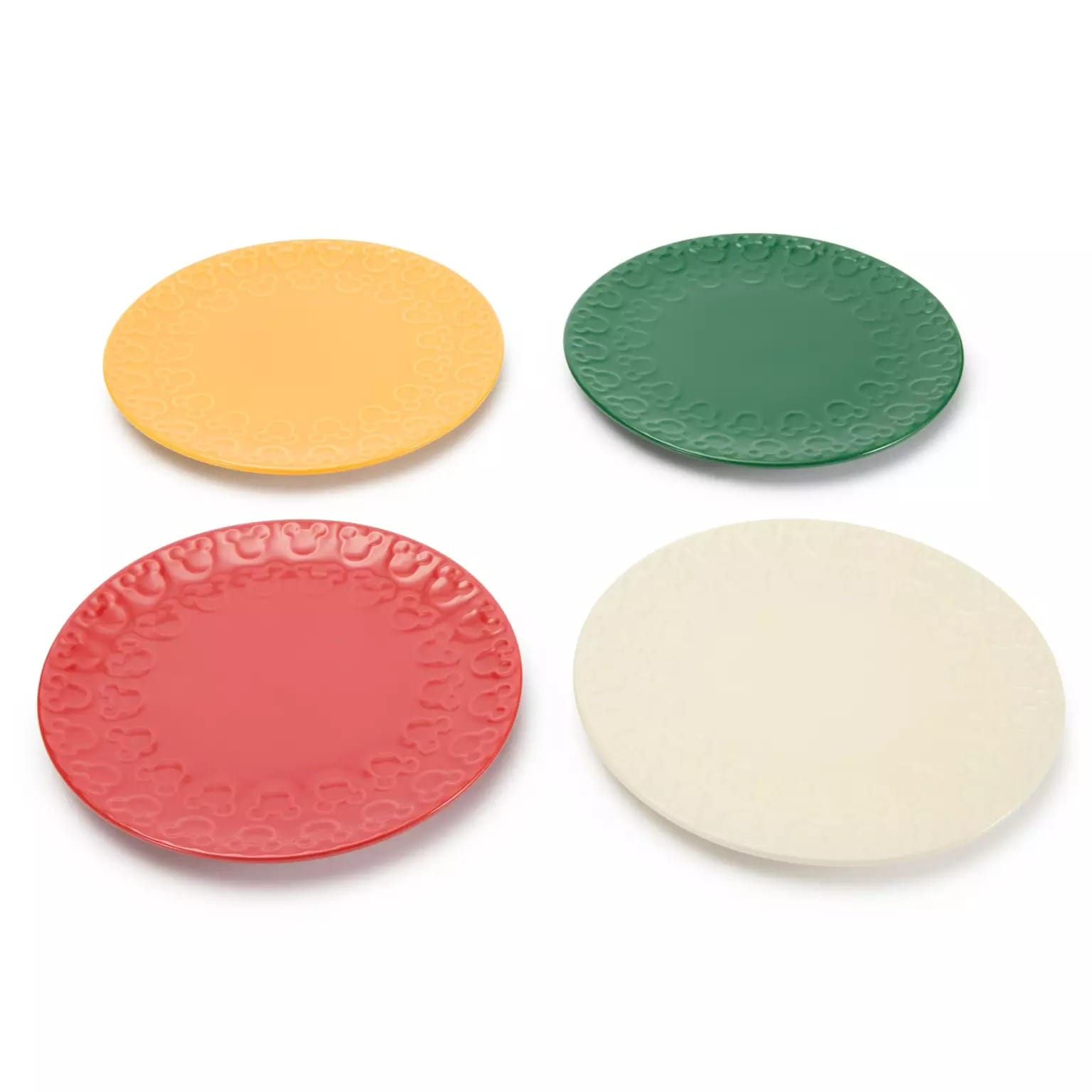 Four round plates in yellow, green, red, and white—festive Disney Christmas Merchandise for your 2025 celebrations.