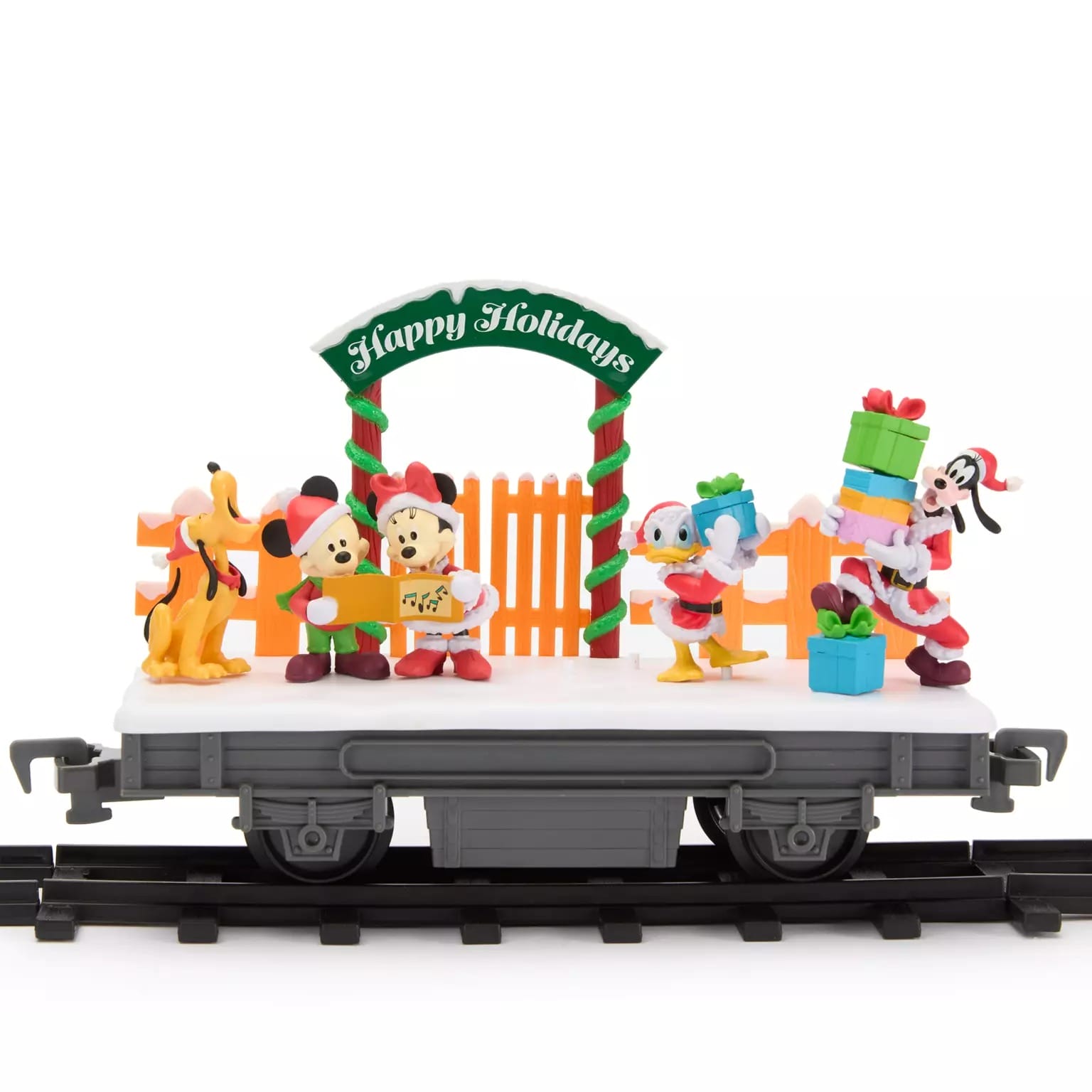 Disney Store 2025 Disney Christmas Merchandise features Pluto, Mickey, Minnie, Donald & Goofy on a festive "Happy Holidays" train.