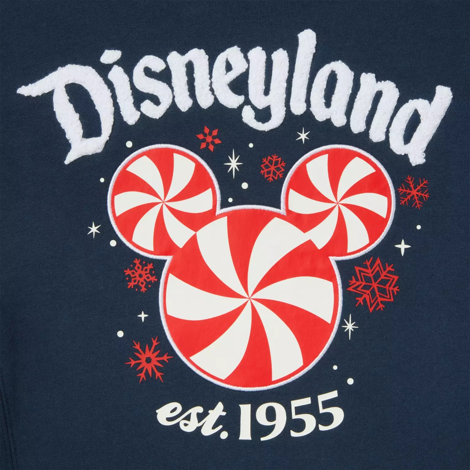 Disney Store logo over a red and white peppermint Mickey head, with red snowflakes and “est. 1955” below.