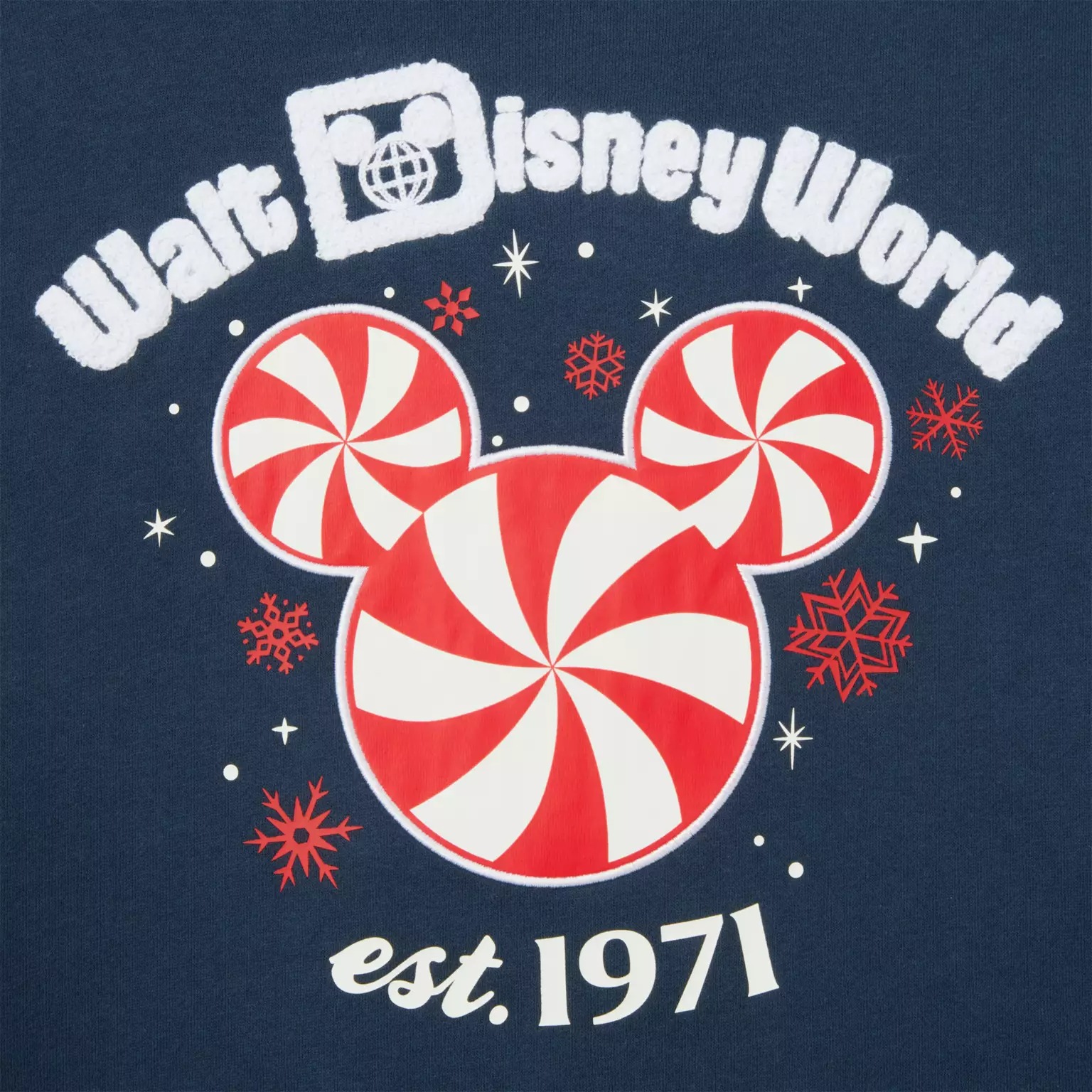 Walt Disney World logo with peppermint Mickey and snowflakes, "est. 1971"—a festive Disney Christmas Merchandise 2025 design.