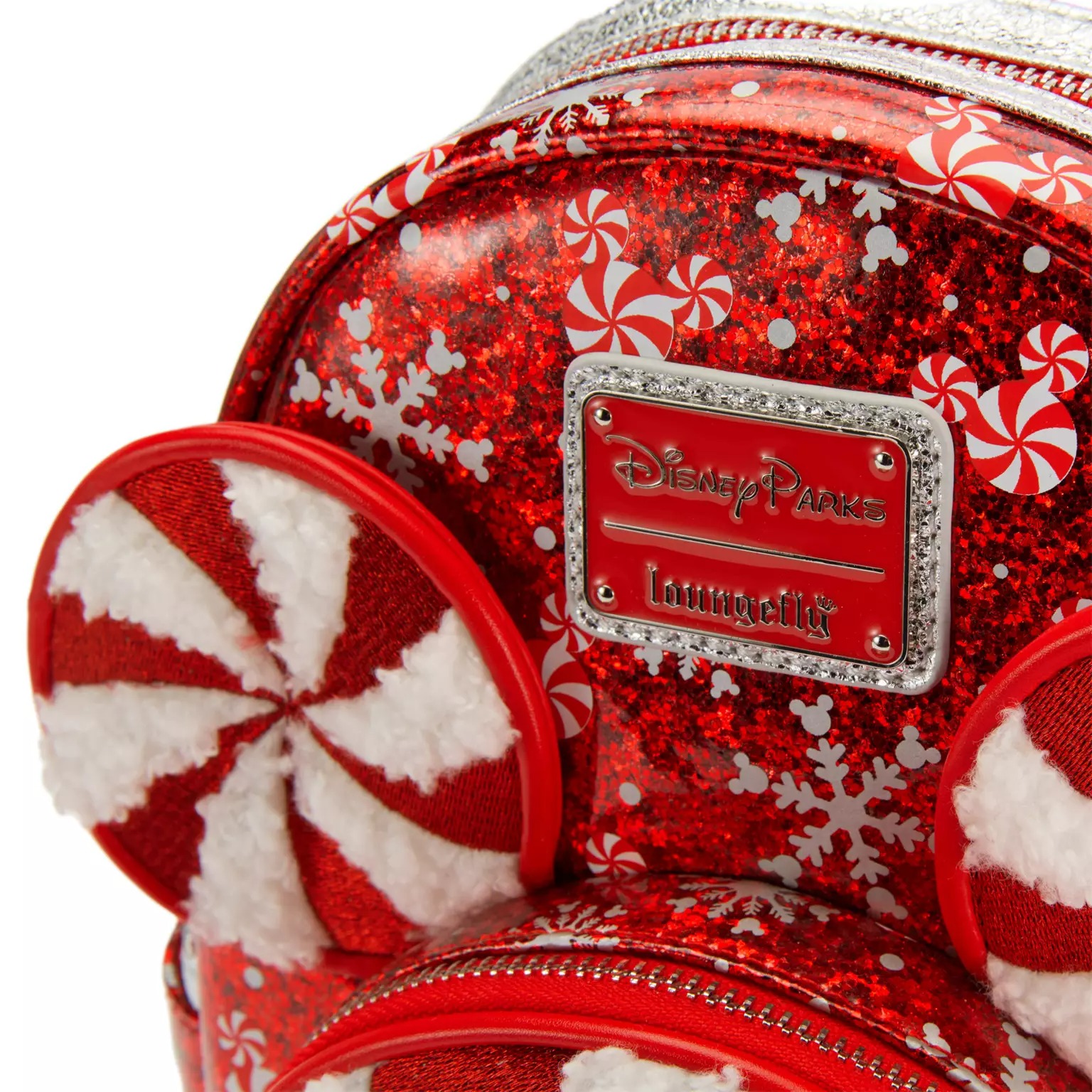 Red glittery Disney Parks Loungefly backpack with peppermint ears, part of 2025 Disney Christmas merchandise.