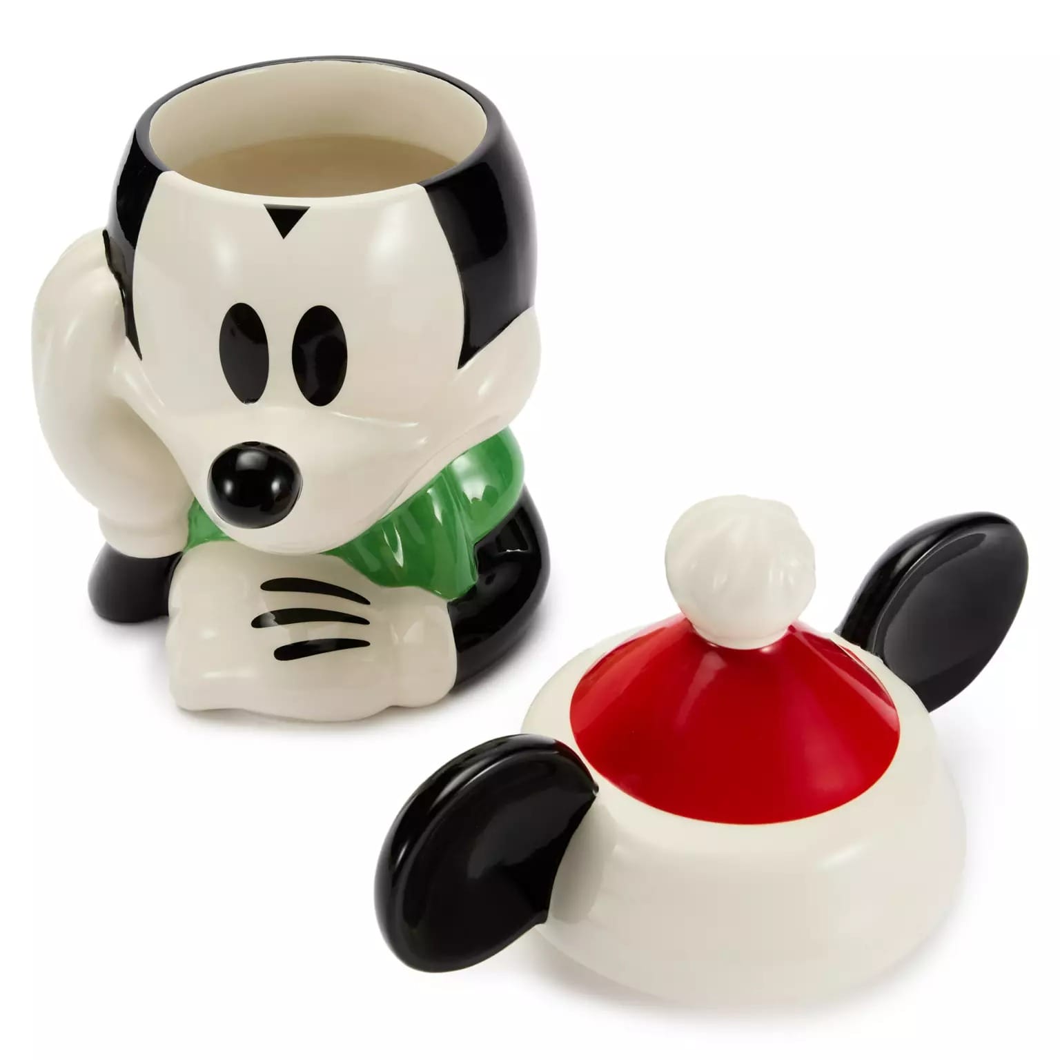 Ceramic Mickey Mouse mug with lid—part of 2025 Disney Christmas merchandise—rests on a white surface.