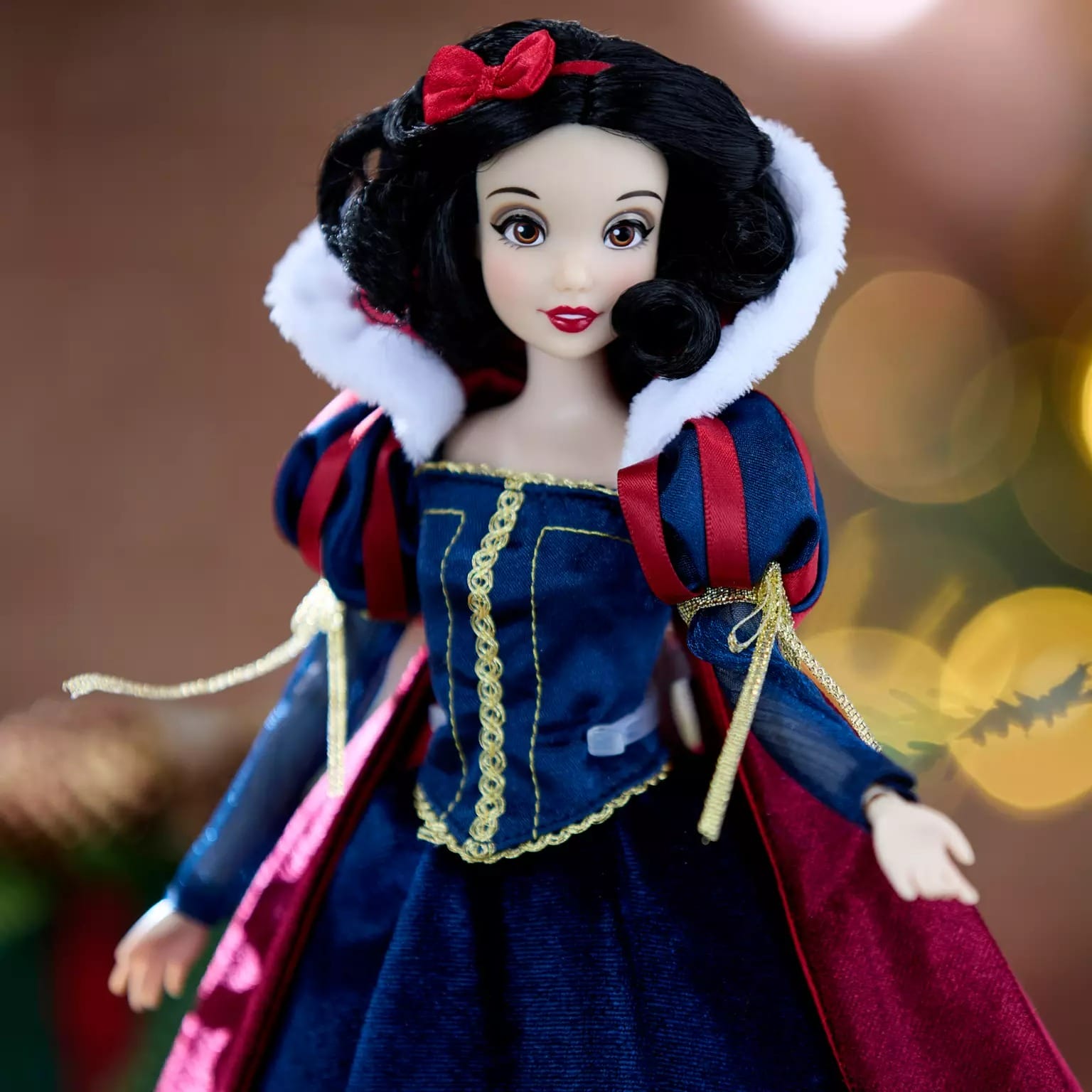 A Disney Store Snow White doll in a blue and red dress—part of the 2025 Disney Christmas Merchandise collection.