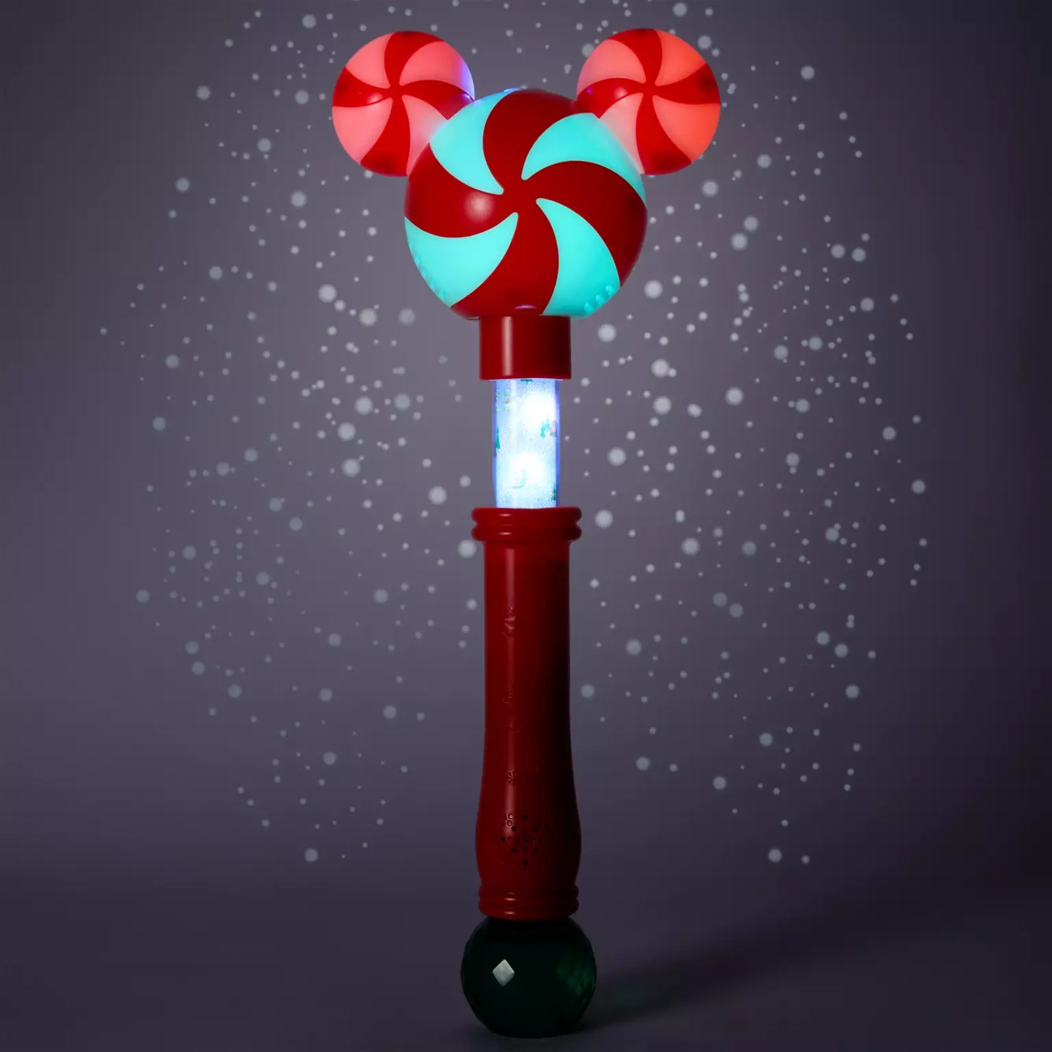 A glowing red and green candy wand with peppermint swirls, part of Disney Store’s 2025 Christmas merchandise collection.