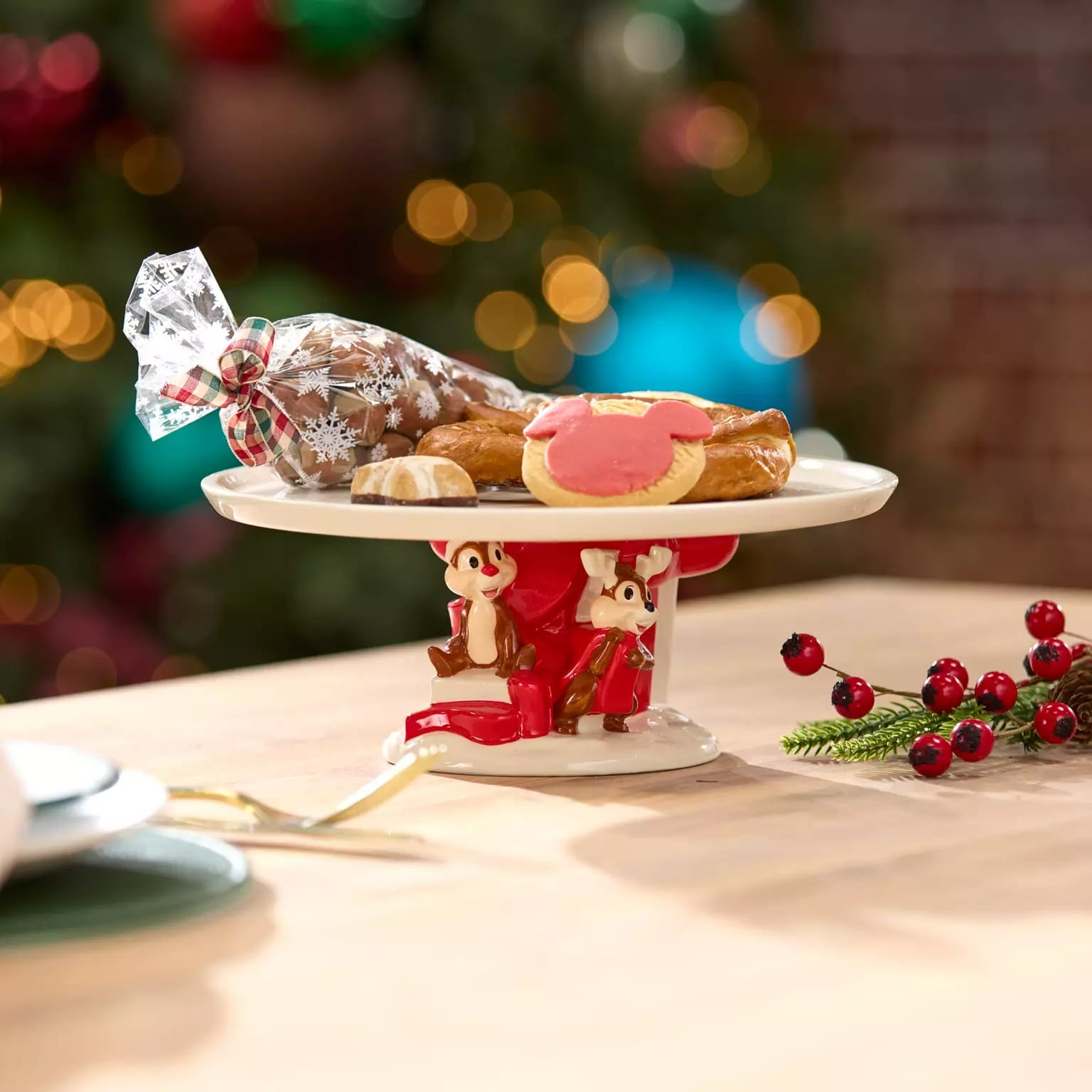 A holiday dessert tray with cookies and Chip and Dale figurines, part of 2025 Disney Christmas merchandise.
