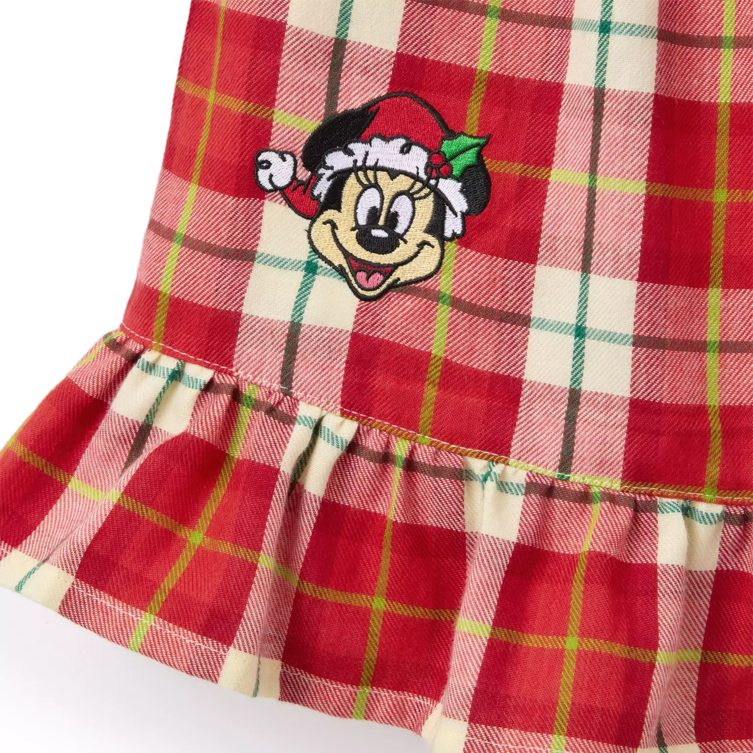 Red and cream plaid fabric with a ruffle hem, featuring a festive Disney Store cartoon mouse in a Santa hat for 2025.