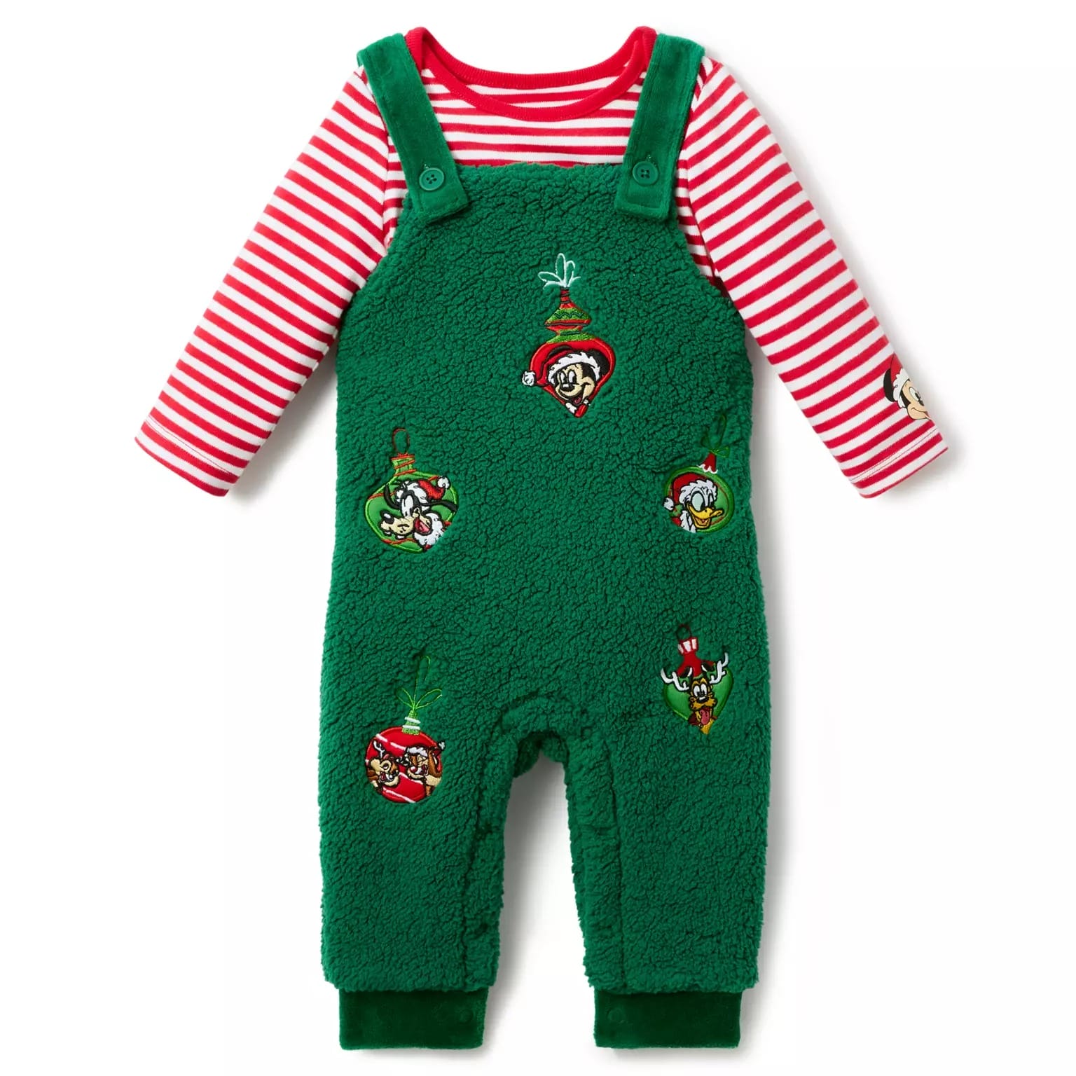 Green fleece overalls with holiday cartoon patches over a red and white striped shirt—perfect Disney Christmas merchandise for 2025.