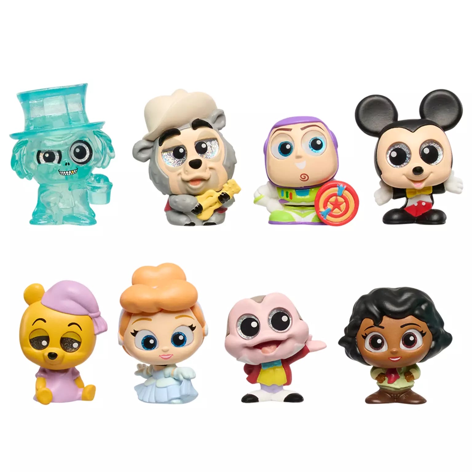 Eight colorful, cartoonish Disney Doorables figurines of Disney Parks Characters are arranged in two rows on a white background.