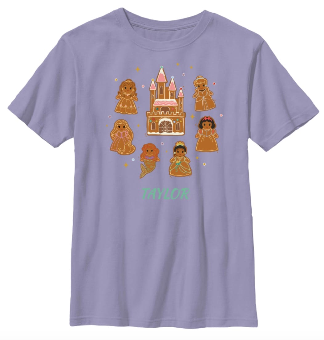 Lavender t-shirt featuring gingerbread princesses and a castle resembling Disneyland's, Disney Store 2025, "Taylor" below.