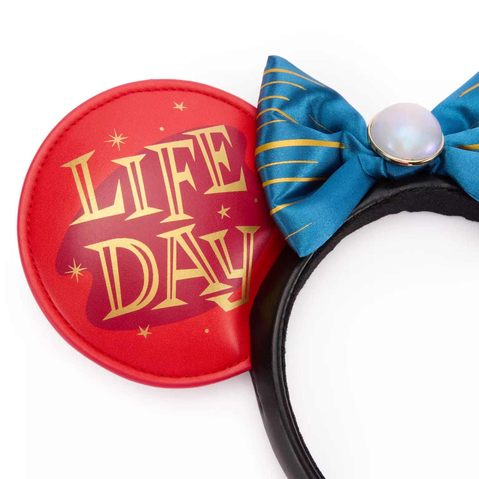 Star Wars Life Day ear headband with "LIFE DAY" text, blue-gold striped bow, and pearl-like center on a black band.
