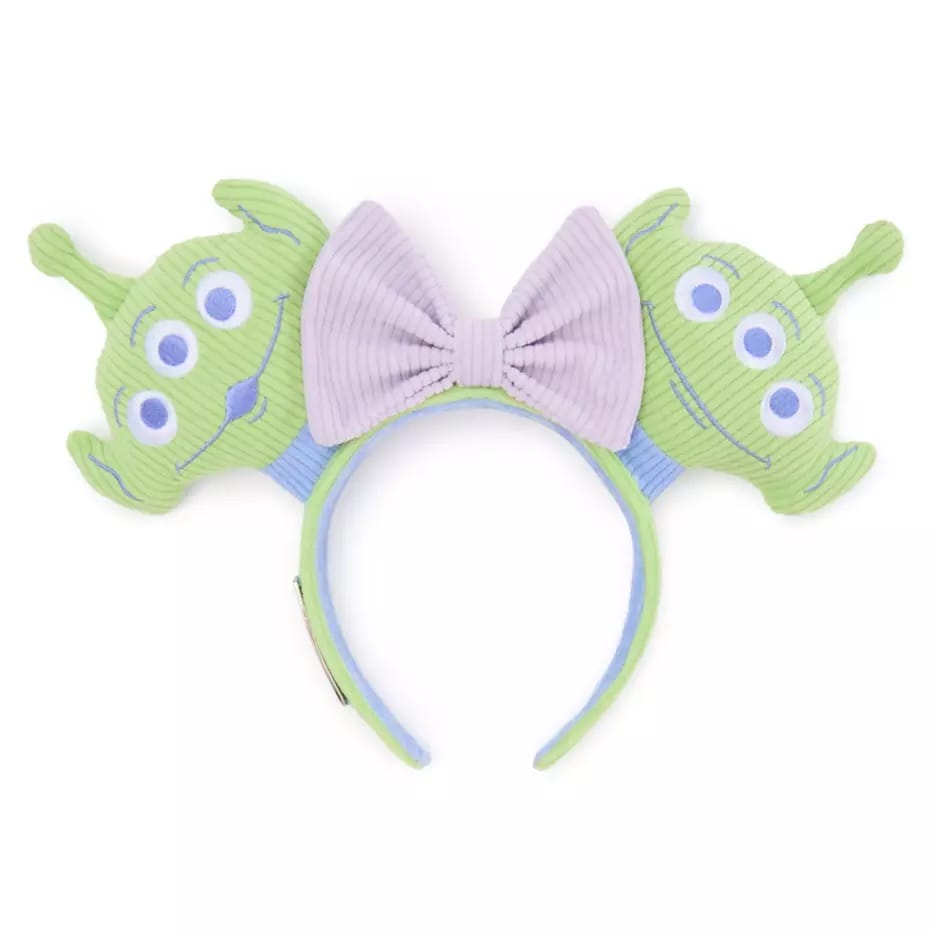 Ear headband with green Toy Story Alien faces and a purple bow, inspired by the Little Green Men.