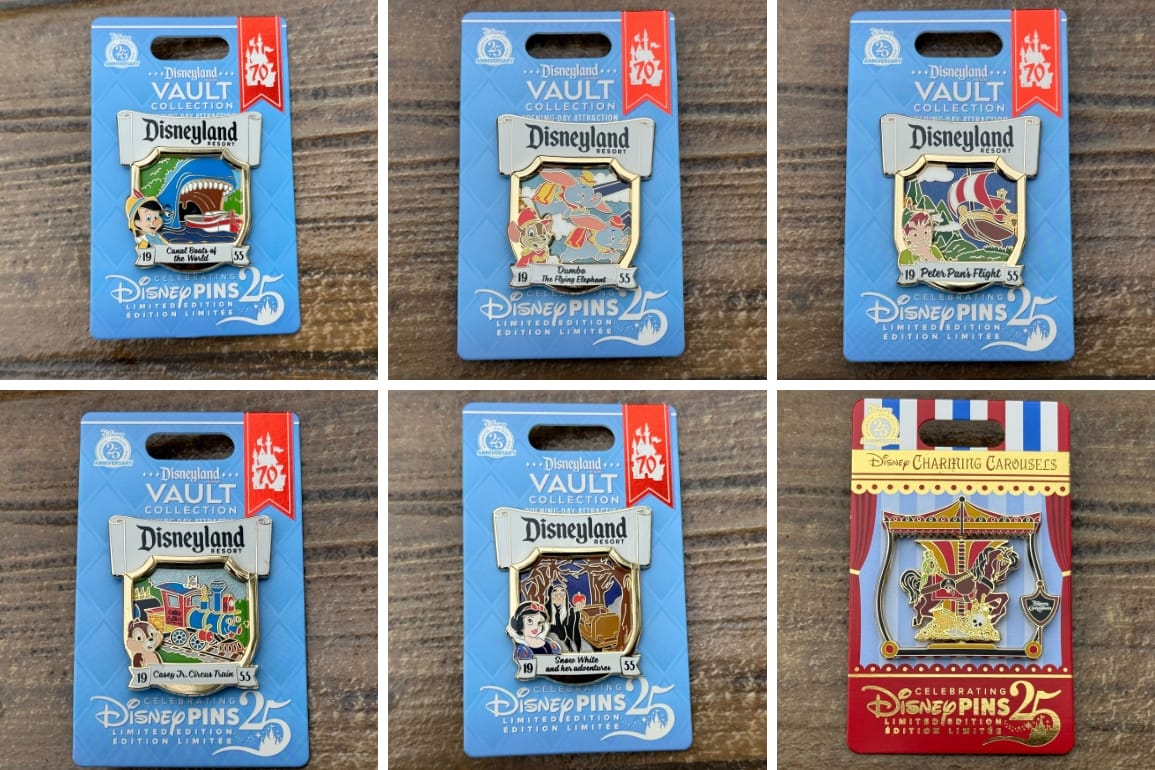 Six Disneyland Resort Opening Day Attraction Pins in packaging, each with ride designs, displayed on a wooden surface.