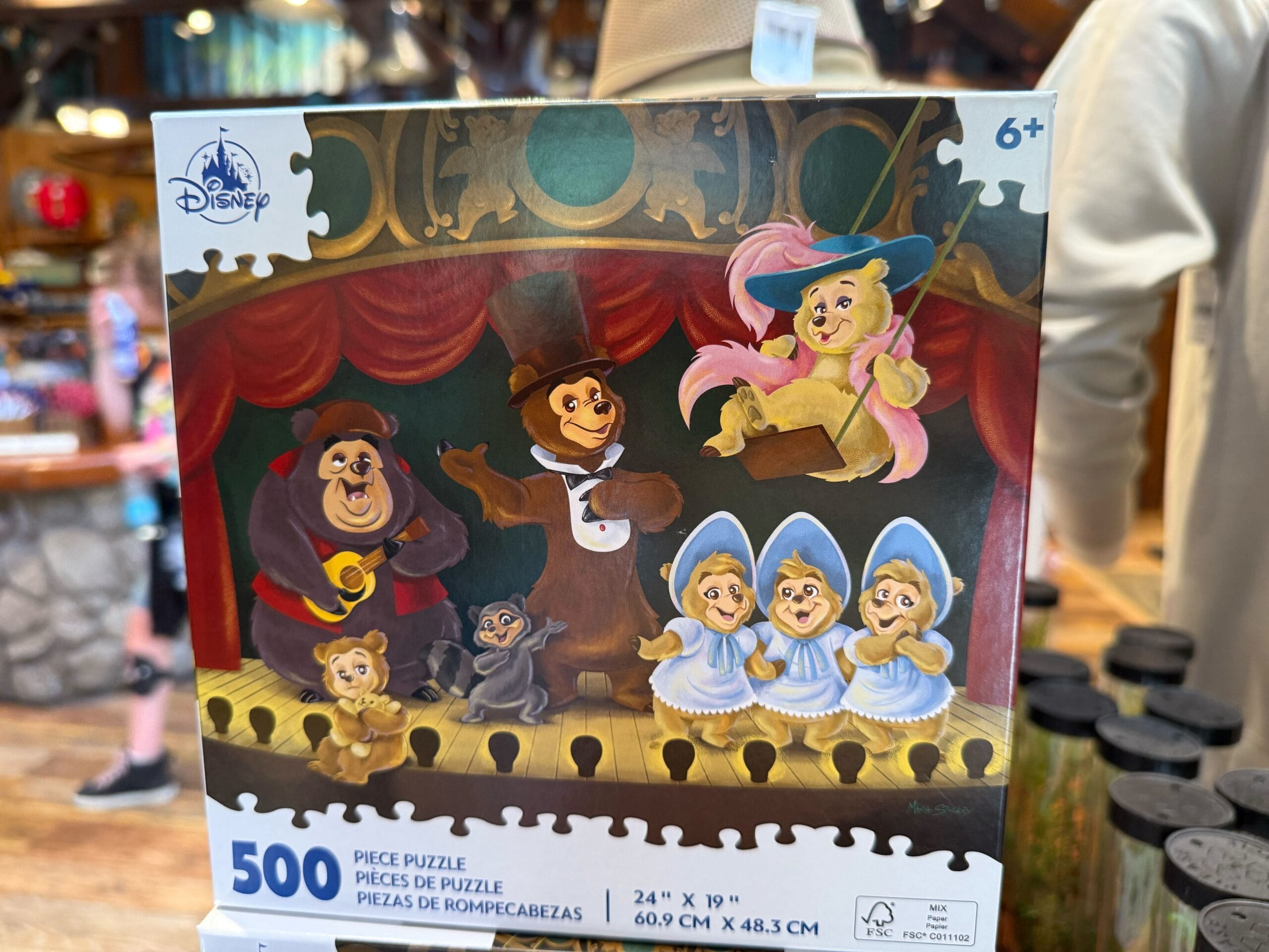 A 500-piece Disney puzzle featuring animatronic bears performing on stage in colorful costumes.