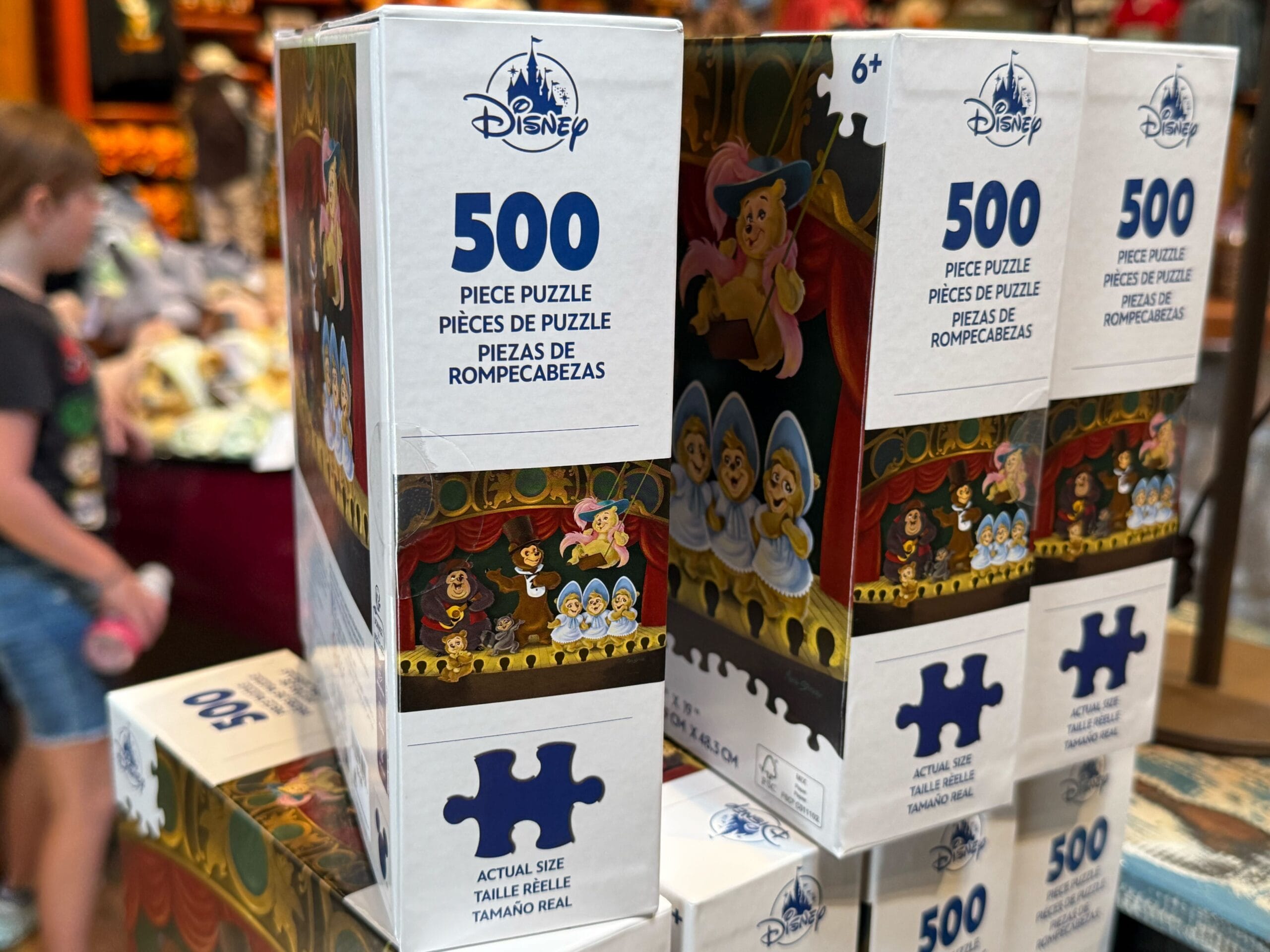 Disney Puzzle 500-piece boxes with Snow White and the Seven Dwarfs stacked on display at California Adventure.