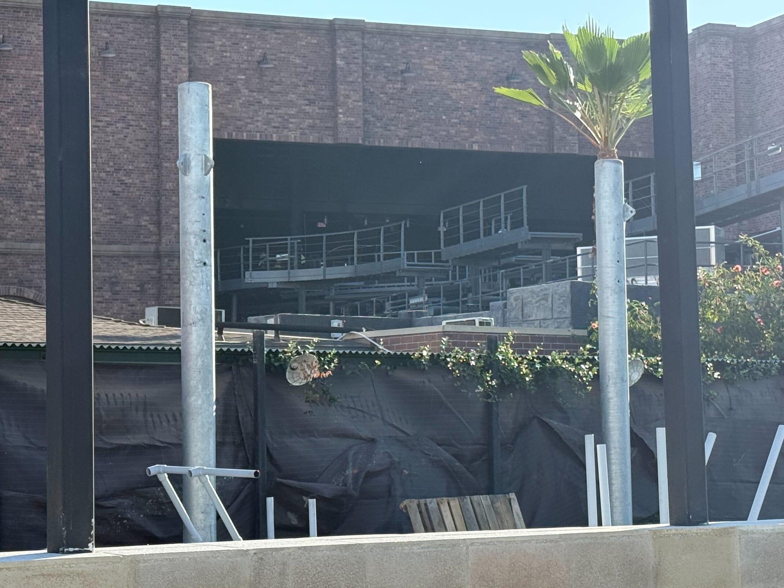 Roller coaster tracks and construction platforms in the brick show building for Fast & Furious: Hollywood Drift at Universal Studios Hollywood.