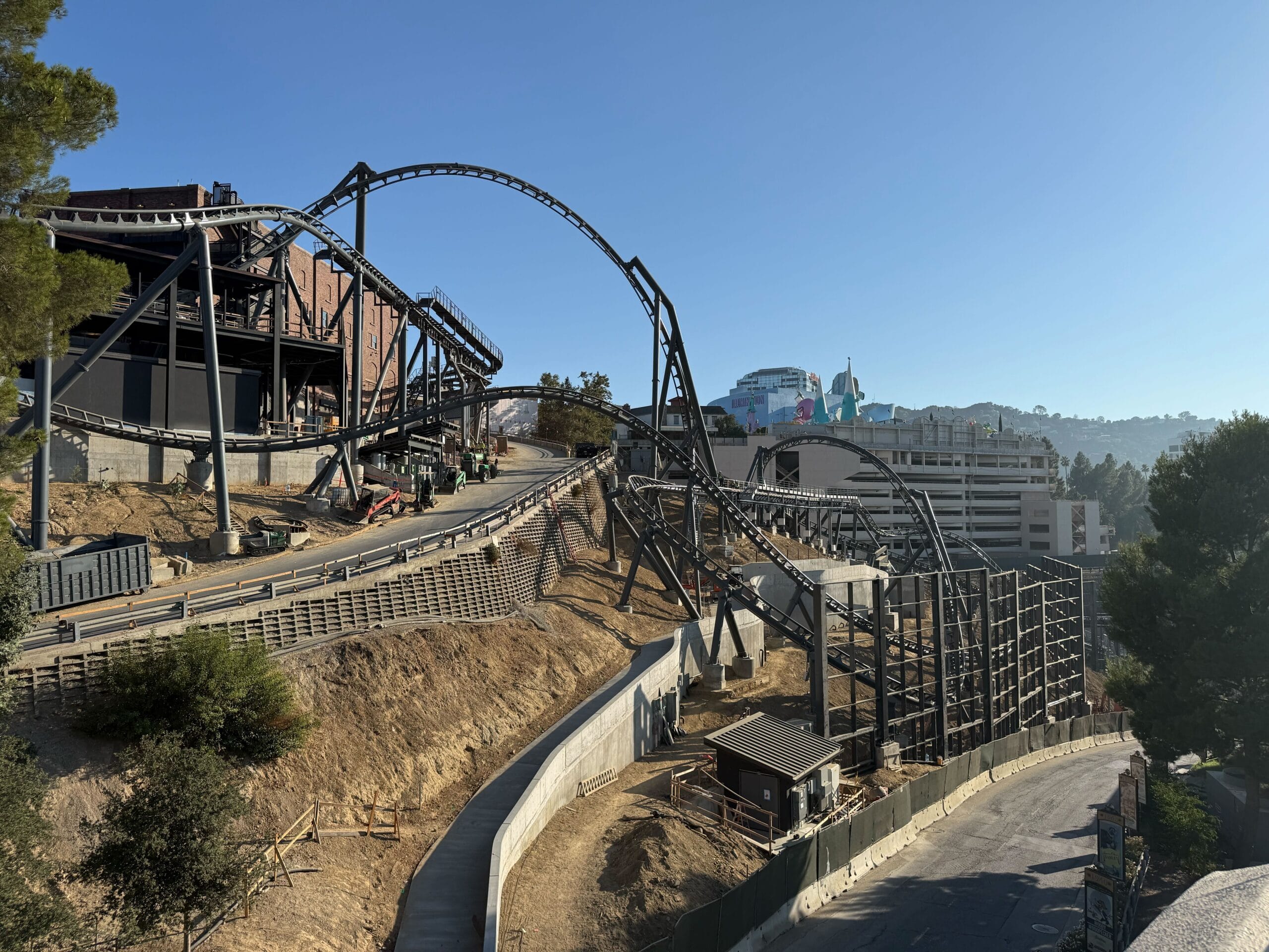 The Fast & Furious: Hollywood Drift roller coaster track curves over service roads at Universal Studios Hollywood.