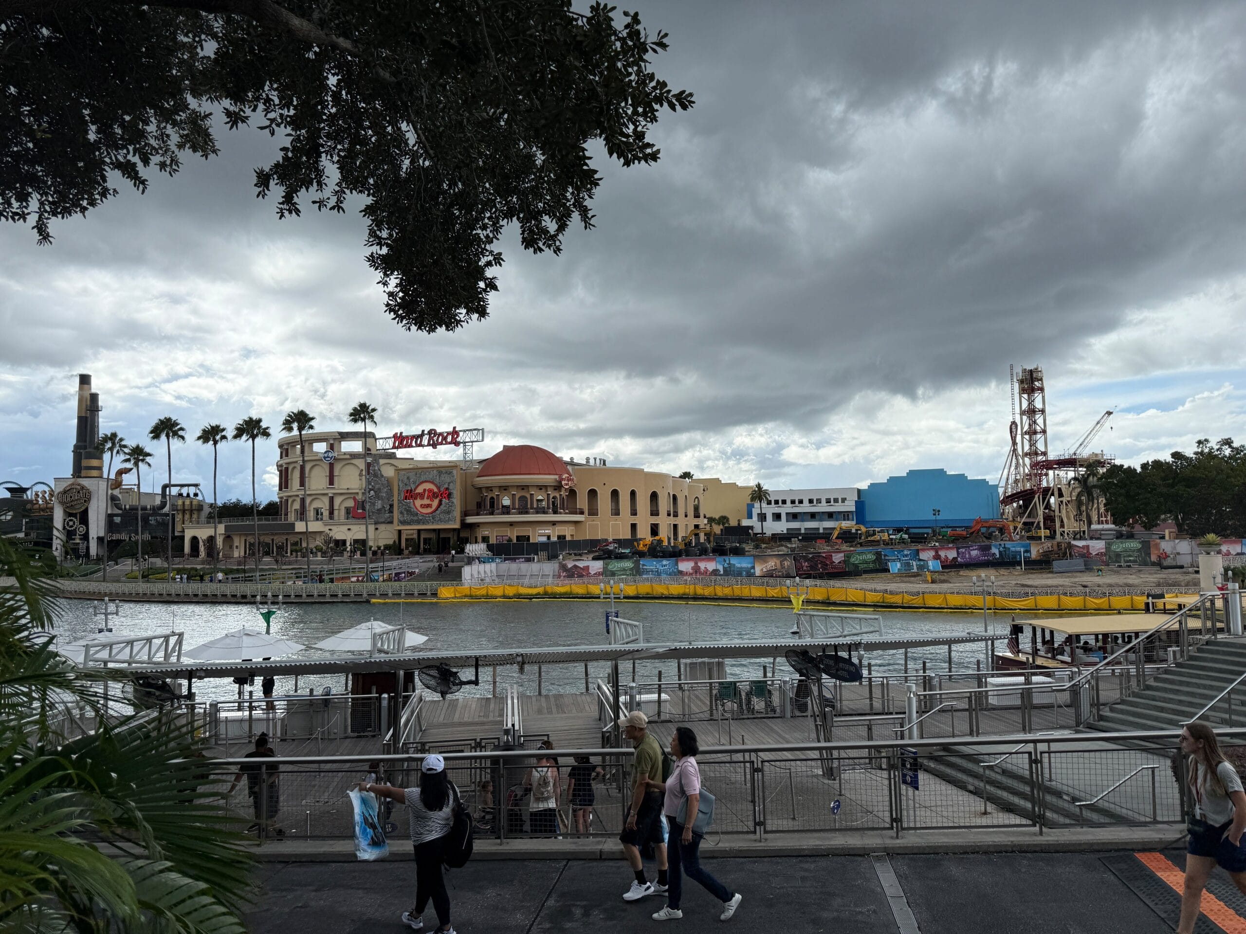 Hollywood Rip Ride Rockit demolition site is visible in the distance across the waterfront with the lift hill still intact.