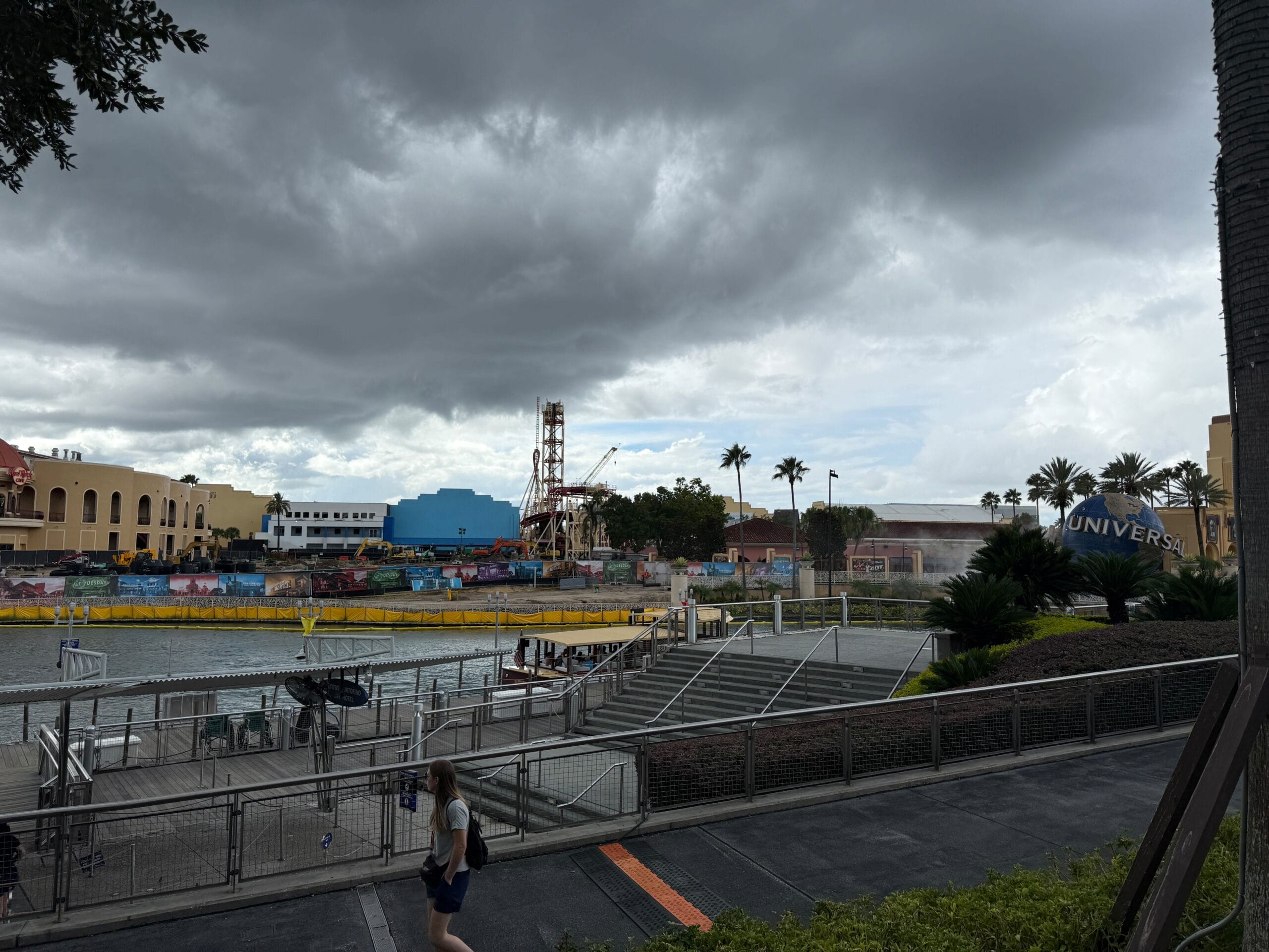 Hollywood Rip Ride Rockit demolition site is visible in the distance across the waterfront with the lift hill still intact.