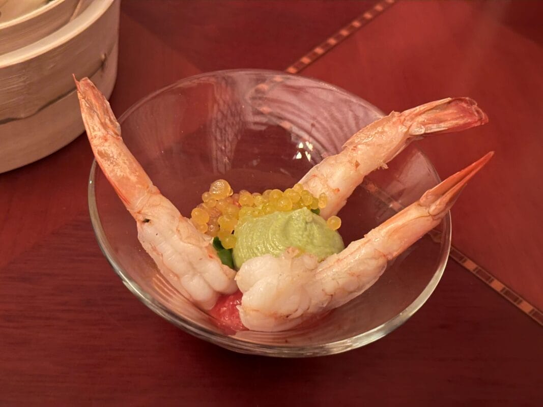 Glass bowl with shrimp, avocado mousse, and citrus pearls, as seen on the Hollywood Brown Derby's Jazzy Holidays menu.