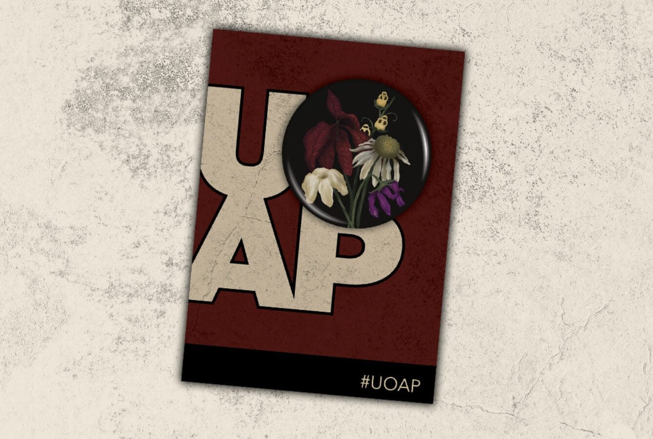 A poster with large "UOAP" letters, a Passholder Button, and #UOAP on a textured background for Universal Annual Passholders.