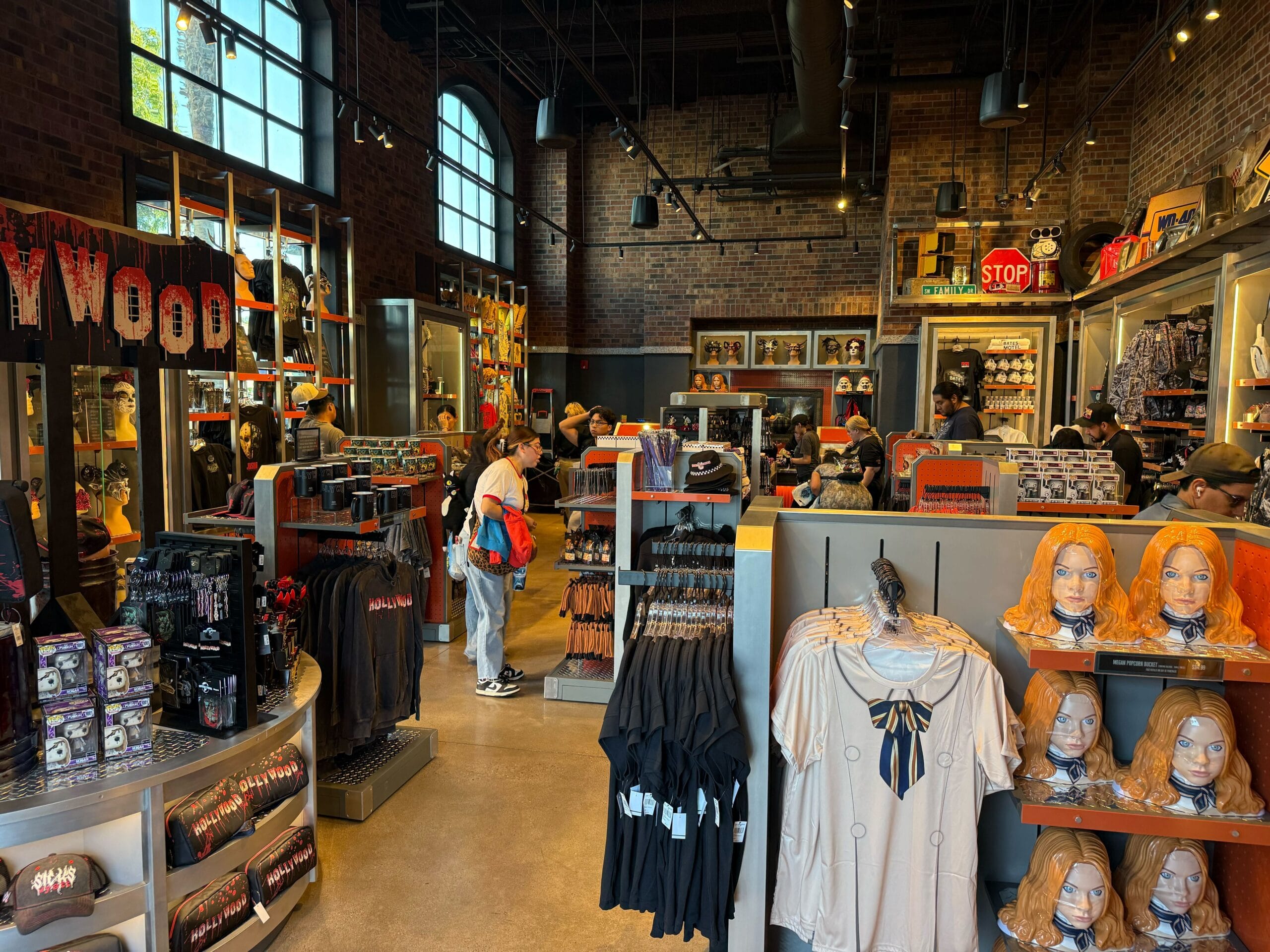 A store at Universal Studios Hollywood filled with horror-themed merchandise, including masks, t-shirts, and figurines.