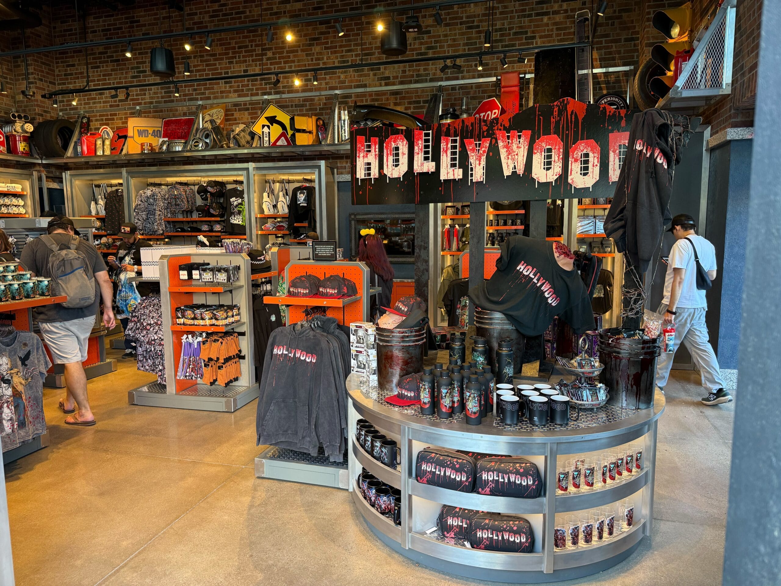 Universal Studios Hollywood store showcases black and red Fast & Furious merchandise, including shirts, mugs, hats, and tumblers.