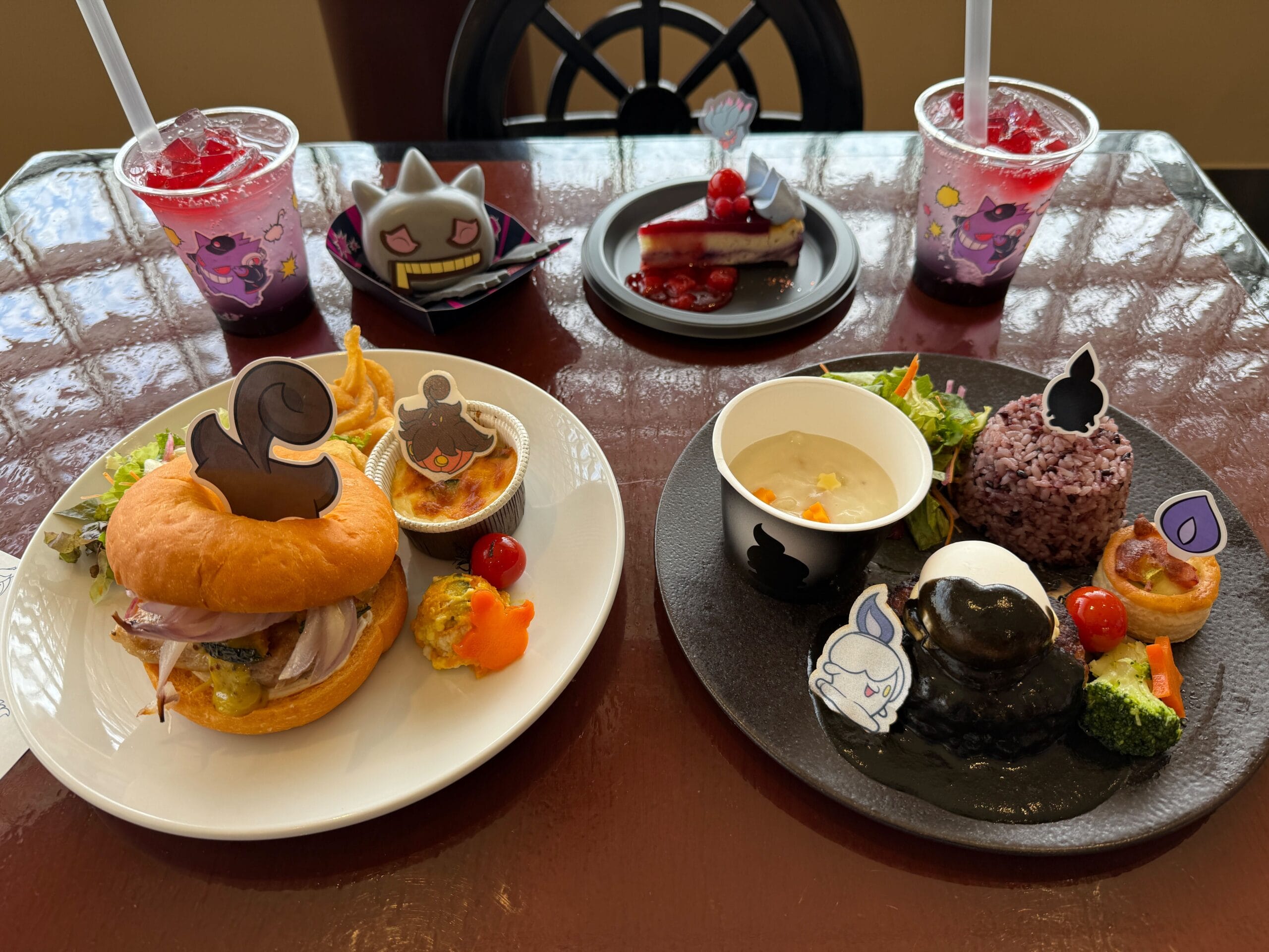 Two colorful character-themed meals and drinks with desserts, featuring cute cartoon decorations and fresh ingredients.