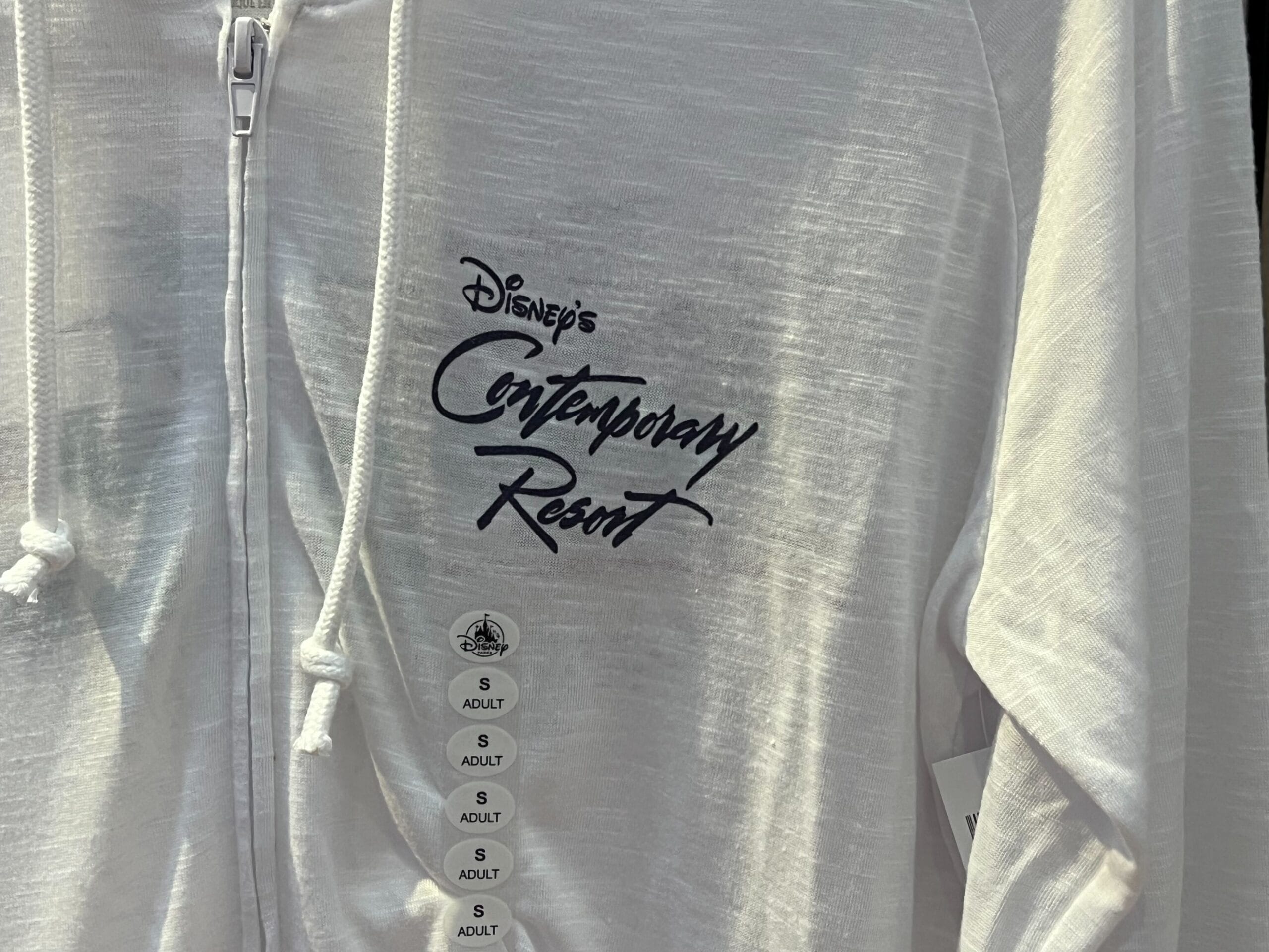 White zip-up hoodie from the Monorail Collection featuring "Disney's Contemporary Resort" text; size "S" and "Adult.