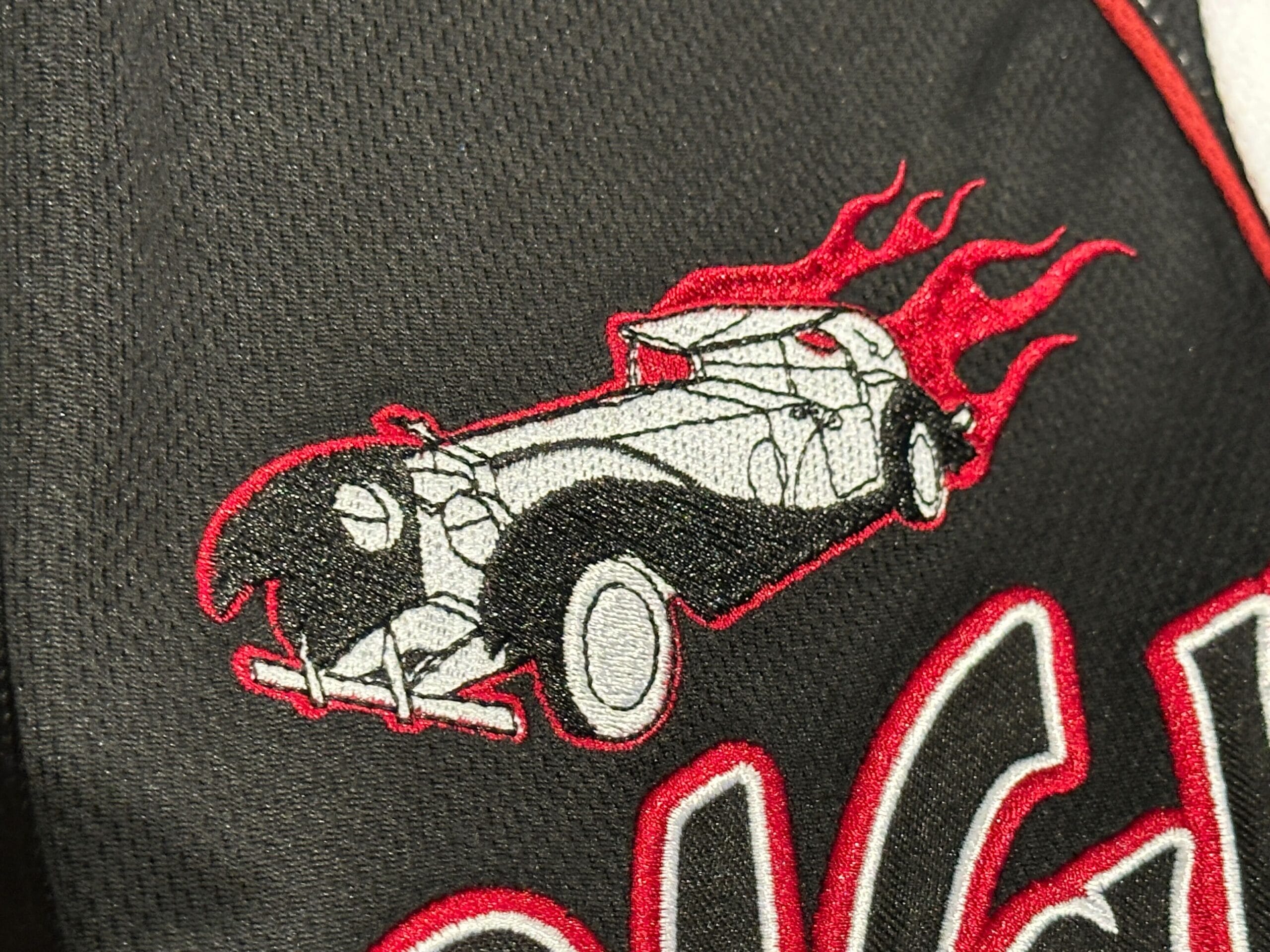Cruella de Vil Baseball Jersey Embroidered patch of a vintage car with red flames, perfect for customizing your Baseball Jersey.