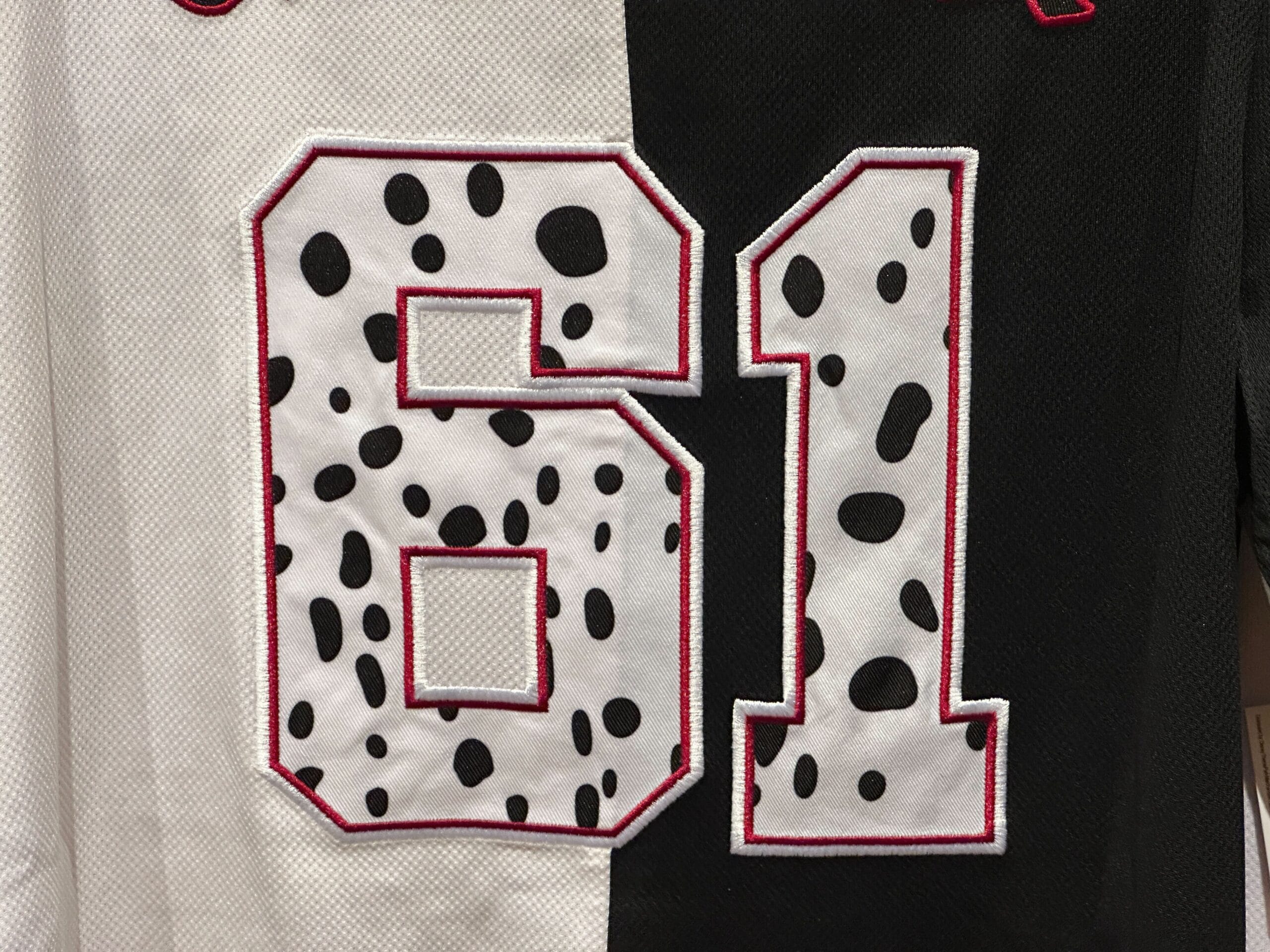 Dalmatian-style black and white baseball jersey with number 61, inspired by Cruella de Vil from the Animal Kingdom.